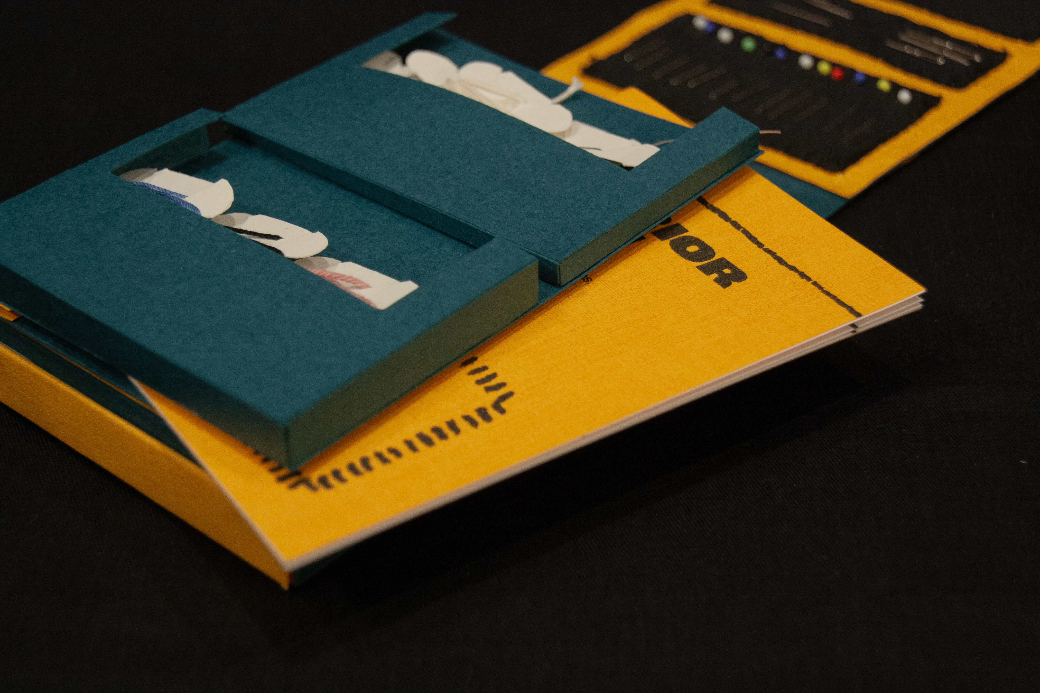 Close-up of a booklet stored within the mending kit