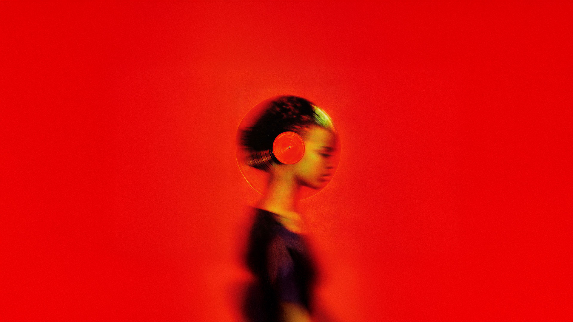 Black and white image of people working at a table with laptops, showing hands gesturing during discussion of digital content displayed on screens, with fabrica® logo in the corner.