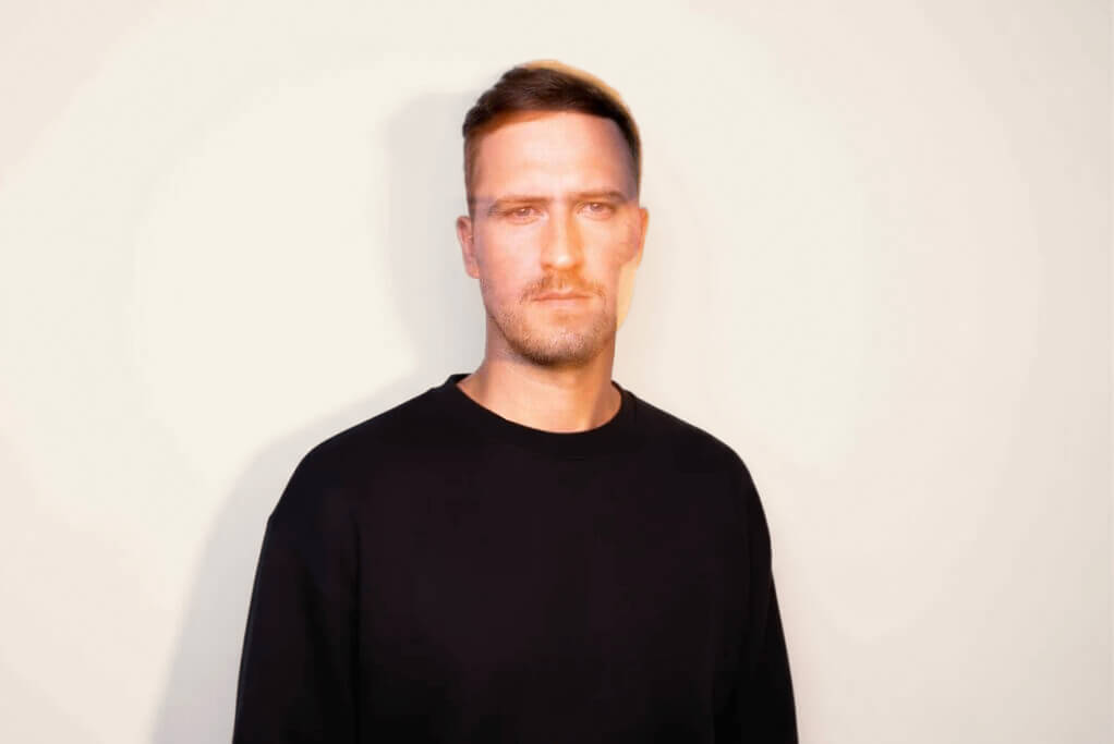 Professional portrait of Petras Nargela, founder of Subsight, wearing a black sweatshirt against a neutral background.