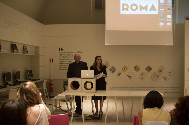 man and woman in a black attire ready to speak