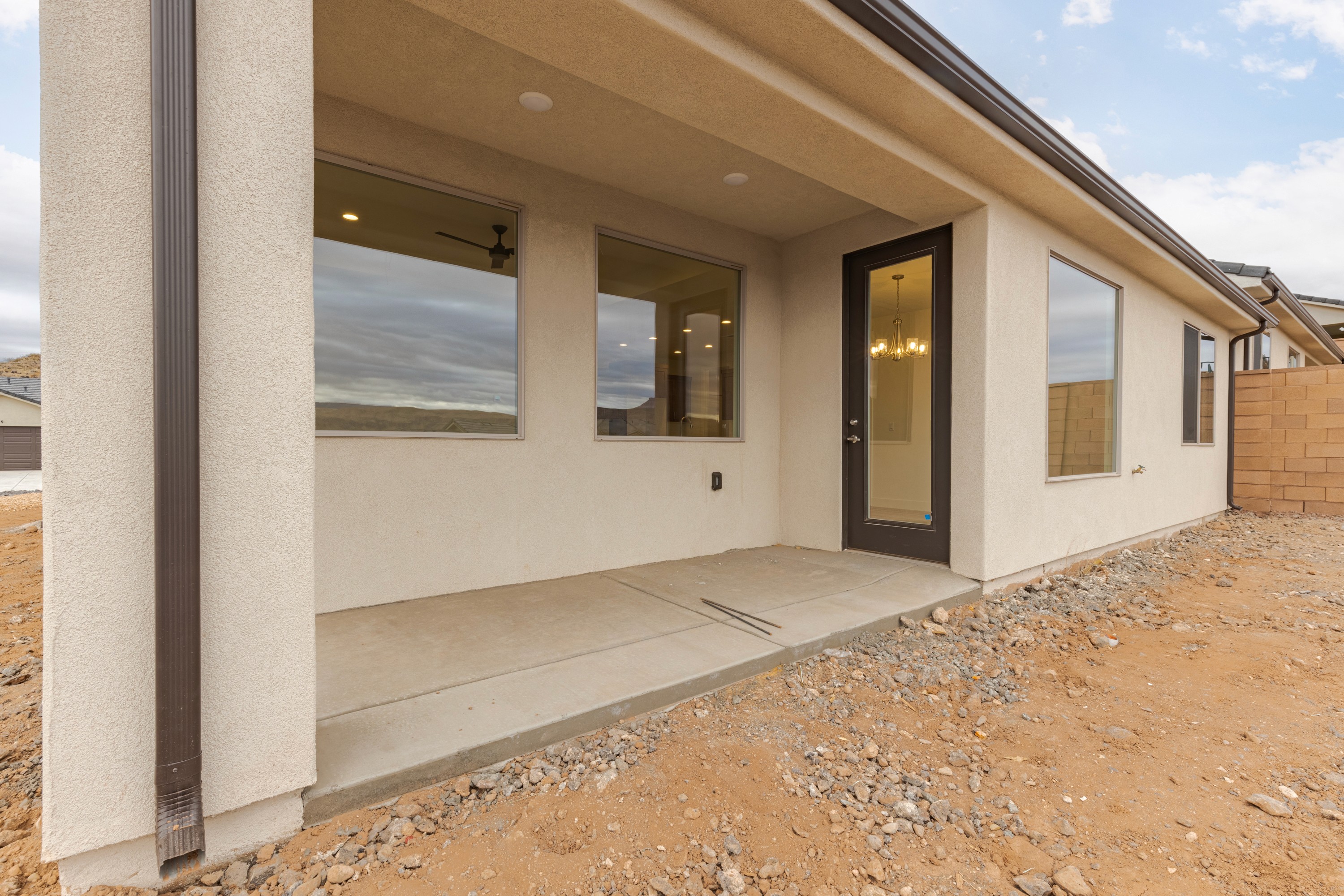 Backyard patio area of the Painted Sands twin home in Hurricane, Utah designed for outdoor living.