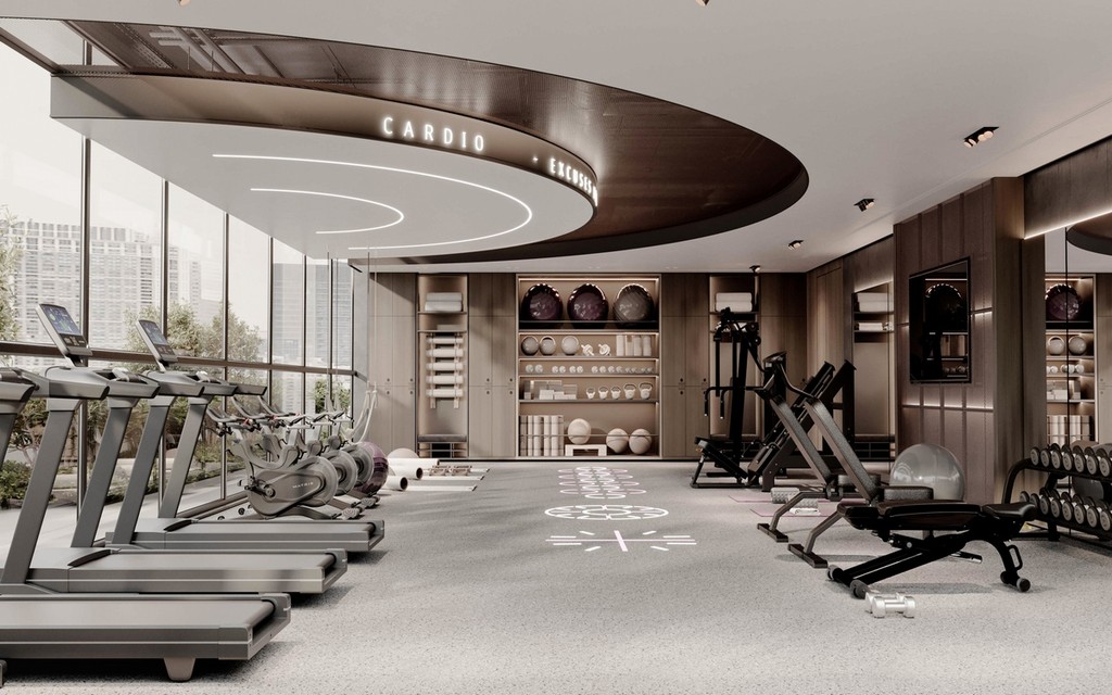 Interior of a gym with a large window and mirror, showcasing the design by Le Blanc by Imtiaz.