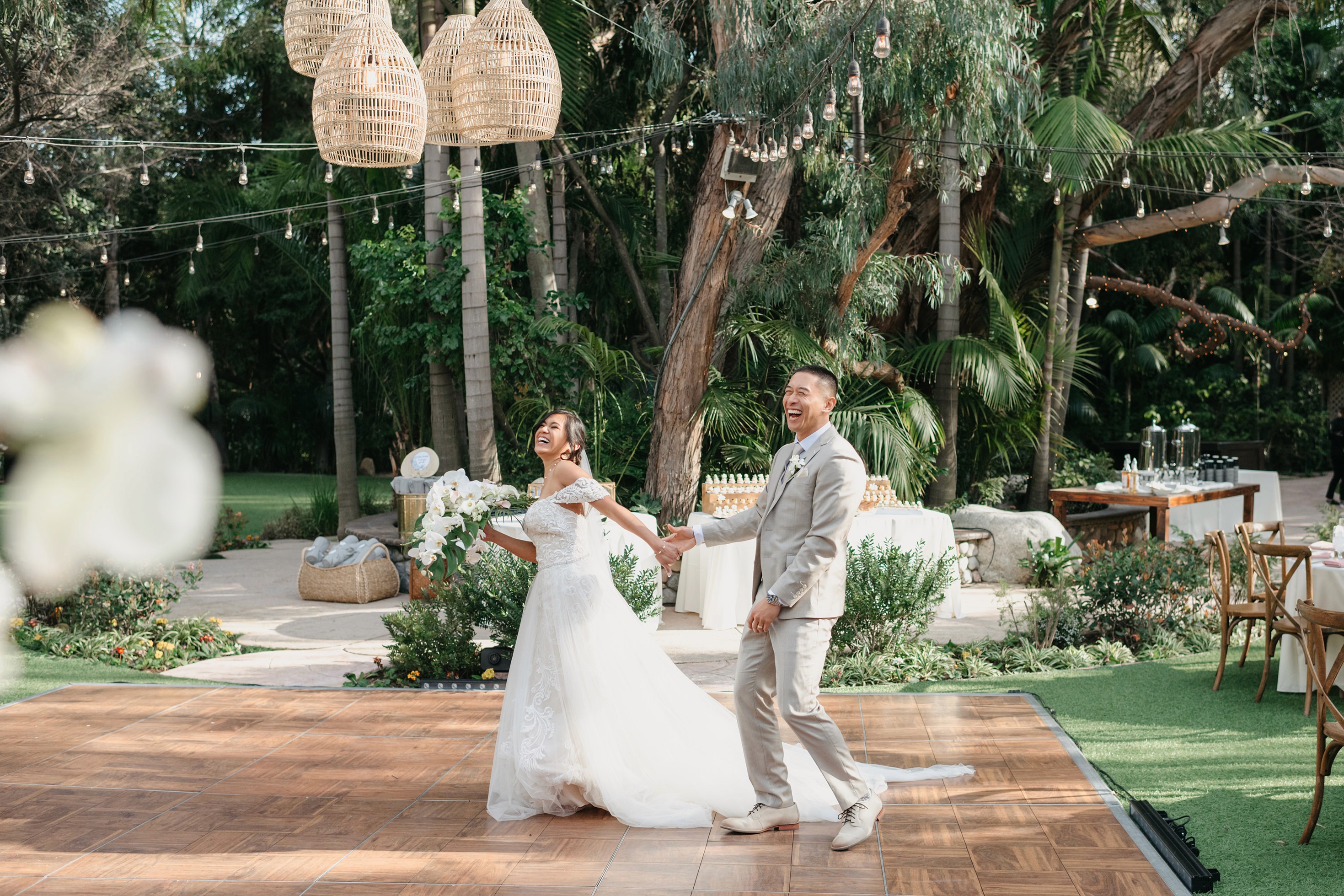 Flat lay wedding details with bouquet, rings, and sparkling bridal heels