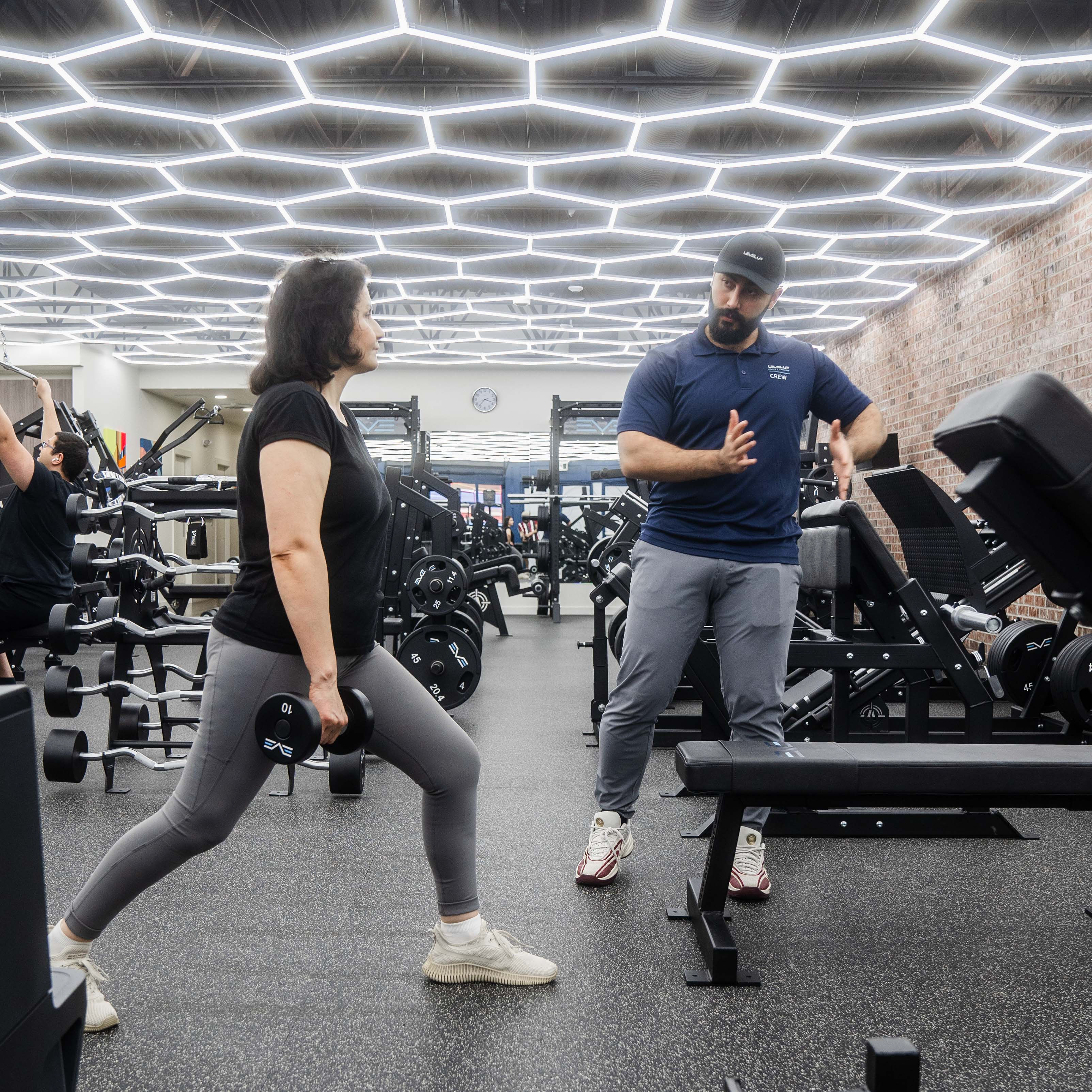 Coach Ario personal training a client