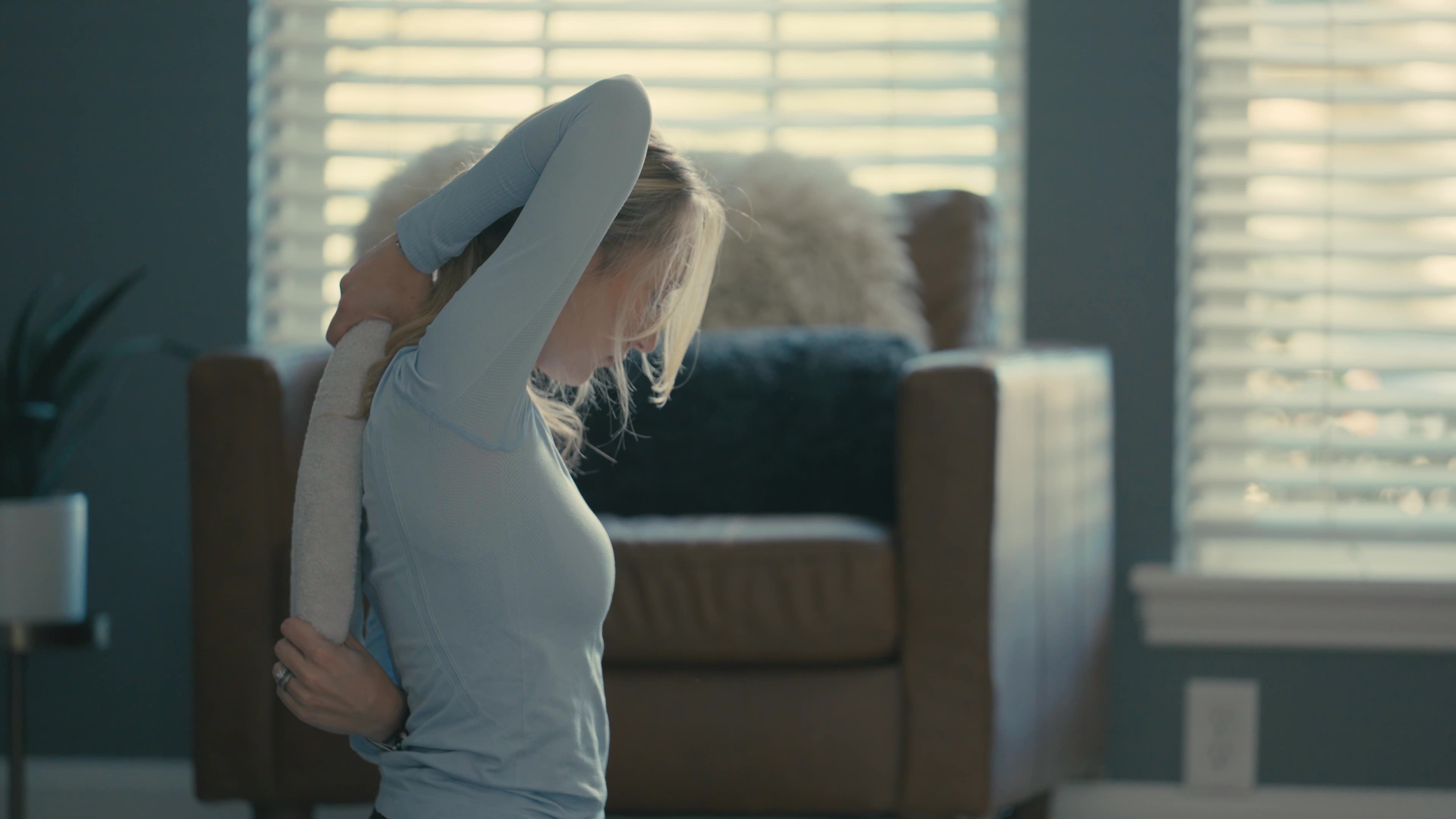 person fixing back - How to Speed Up Muscle Strain Recovery in Back