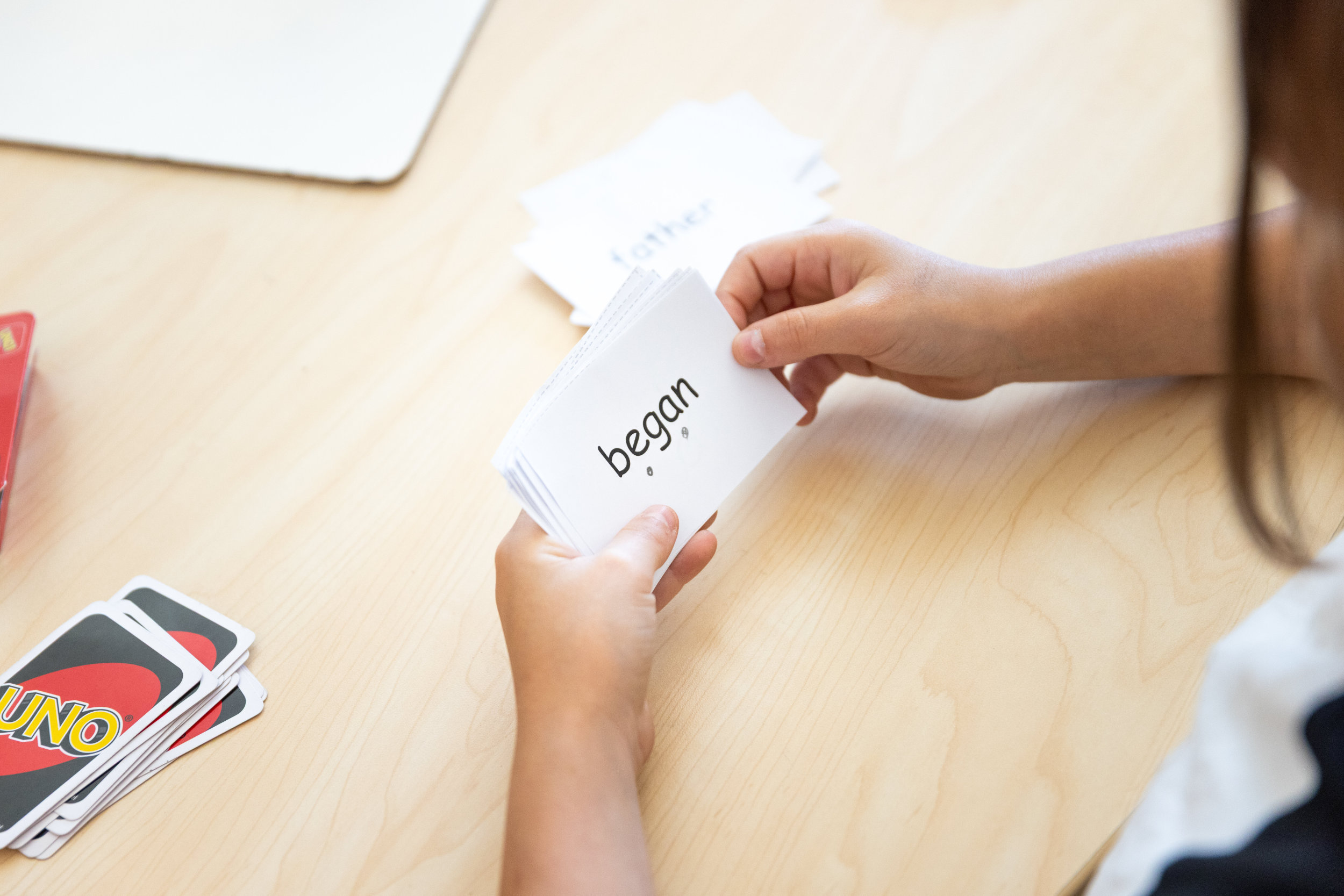 Someone petting dog's chin