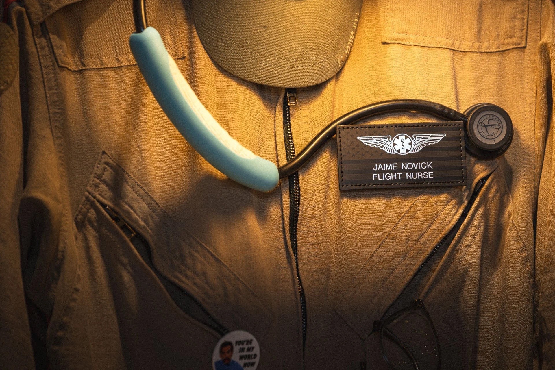 Jamie Novick’s flight nurse uniform displayed at her memorial, with stethoscope and name tag.