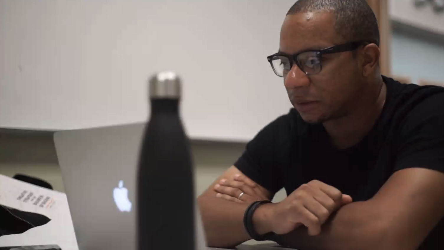 Douglas Davis looking at a laptop