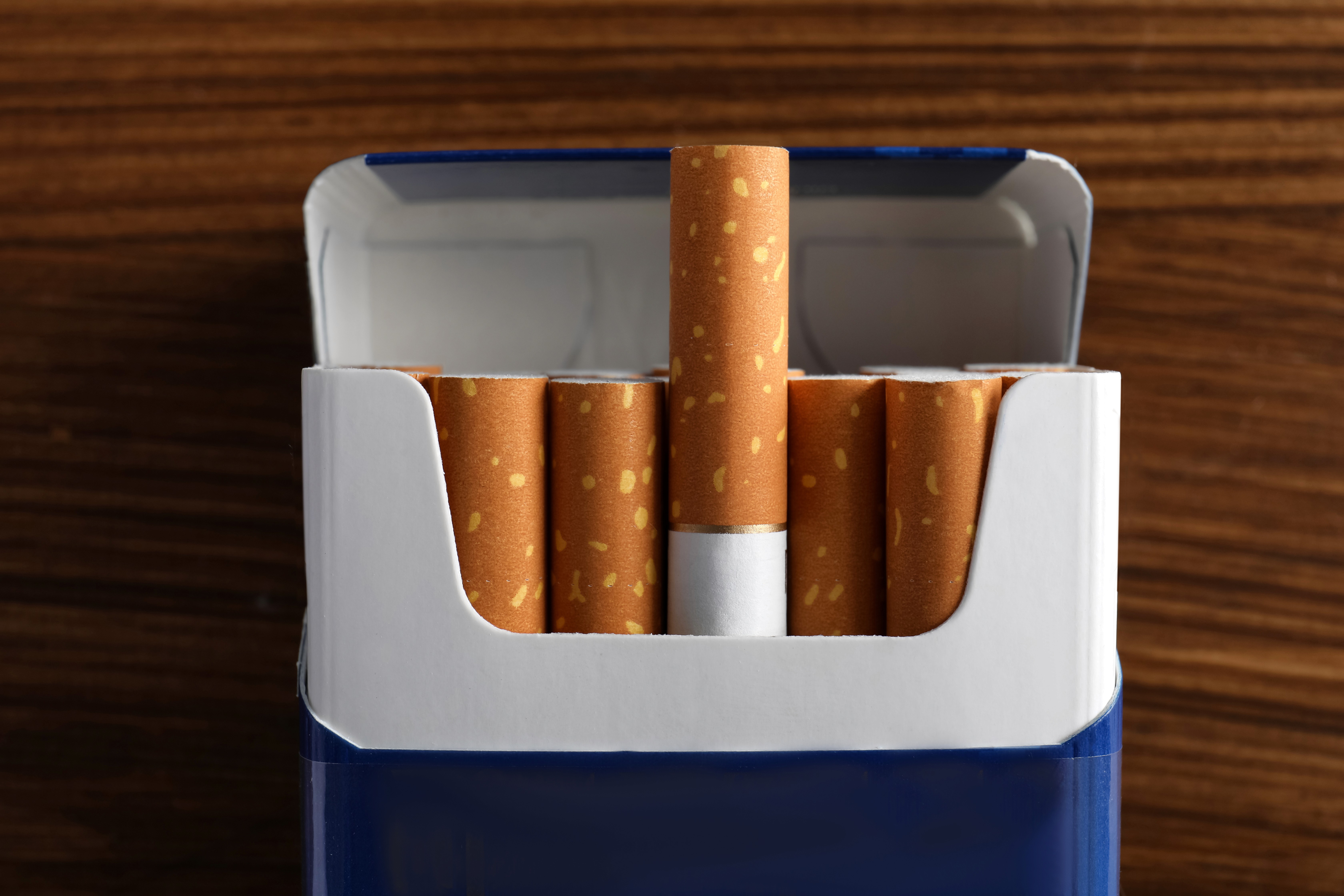 A plain pack of cigrette image with blue color one cigrette raised