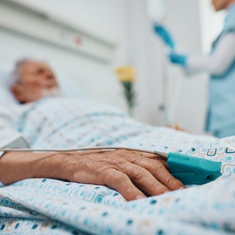 elderly person in hospital bed
