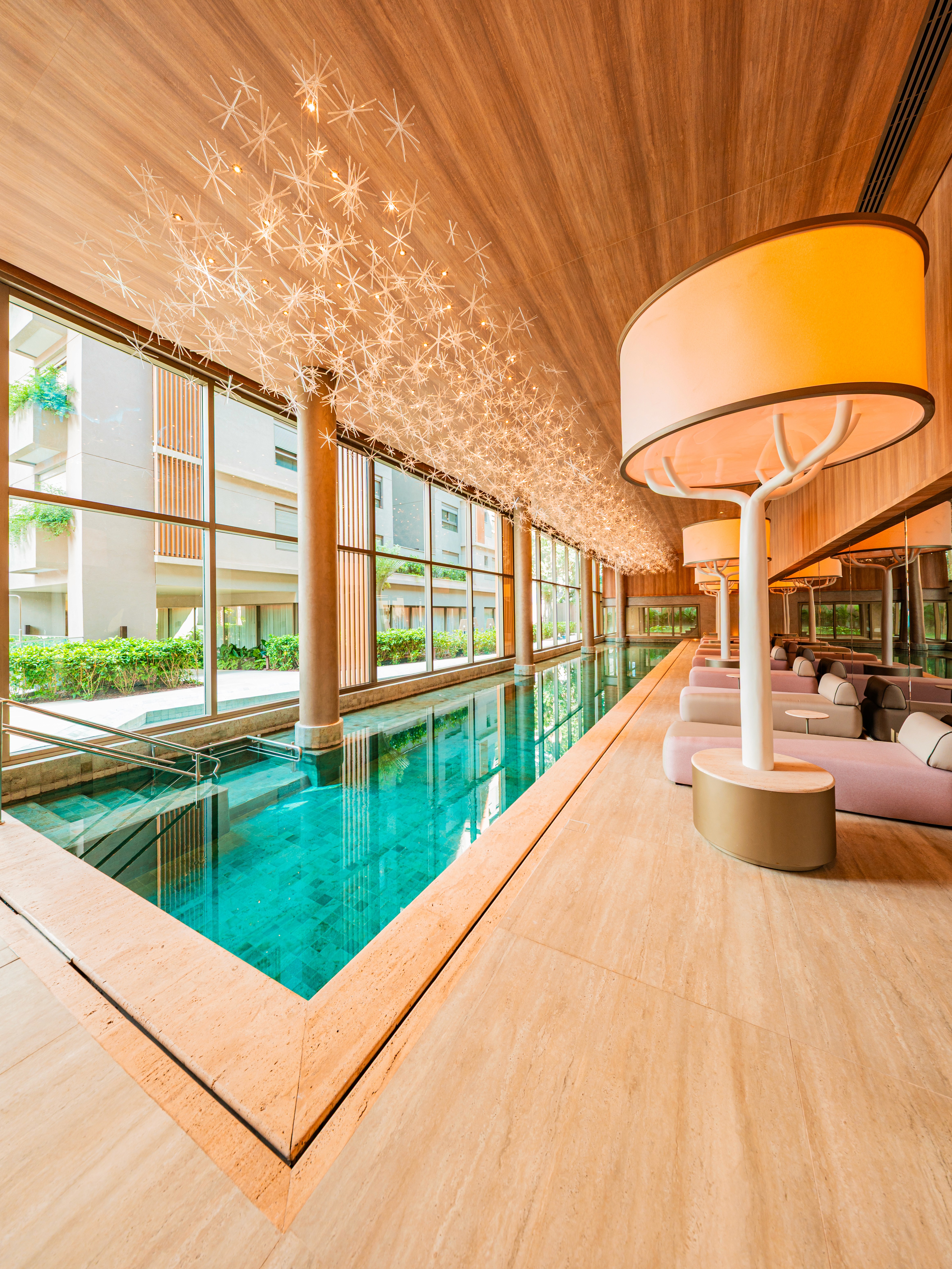 Curved modern skyscraper against a clear blue sky.