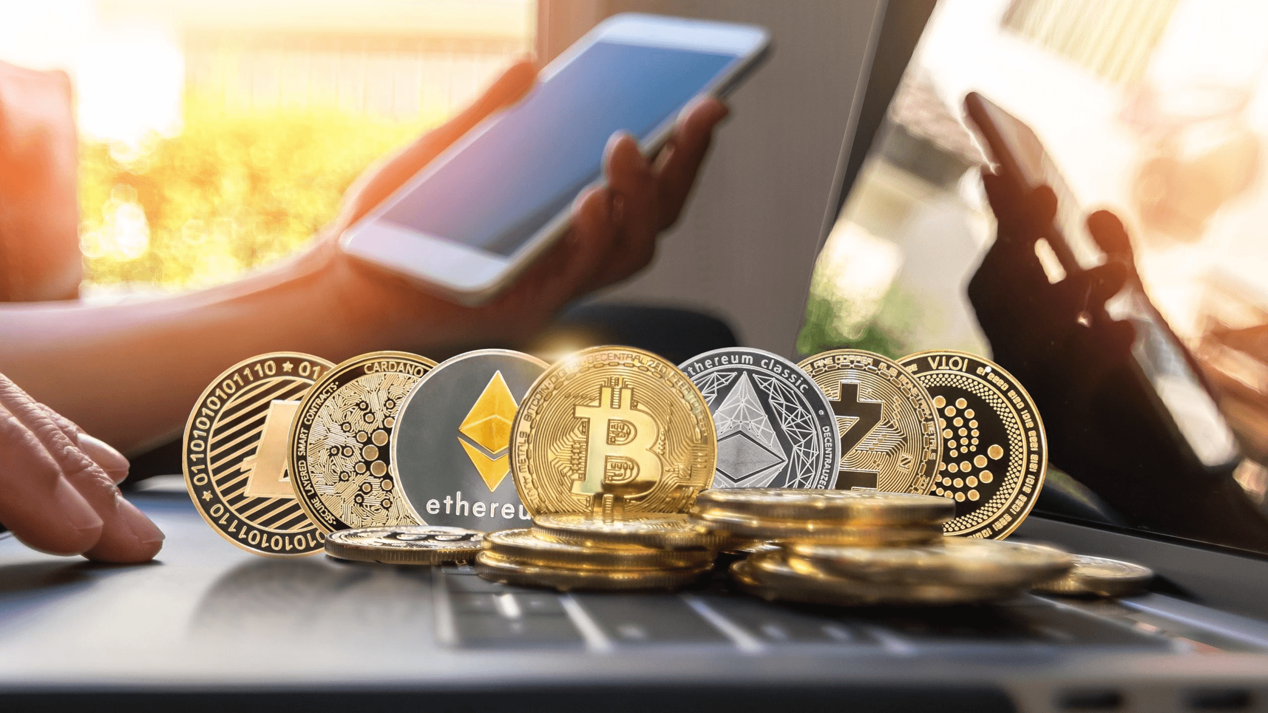 Cryptocurrency coins on a laptop - Tokenomics Examples