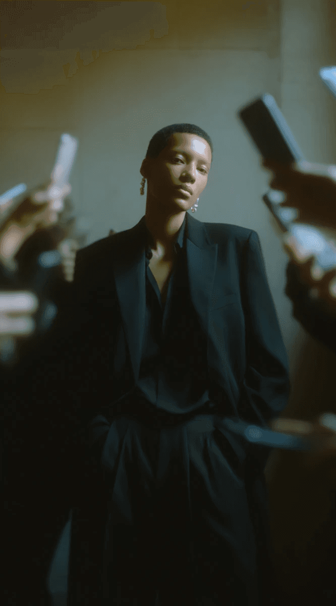 Person surrounded by glowing phones.