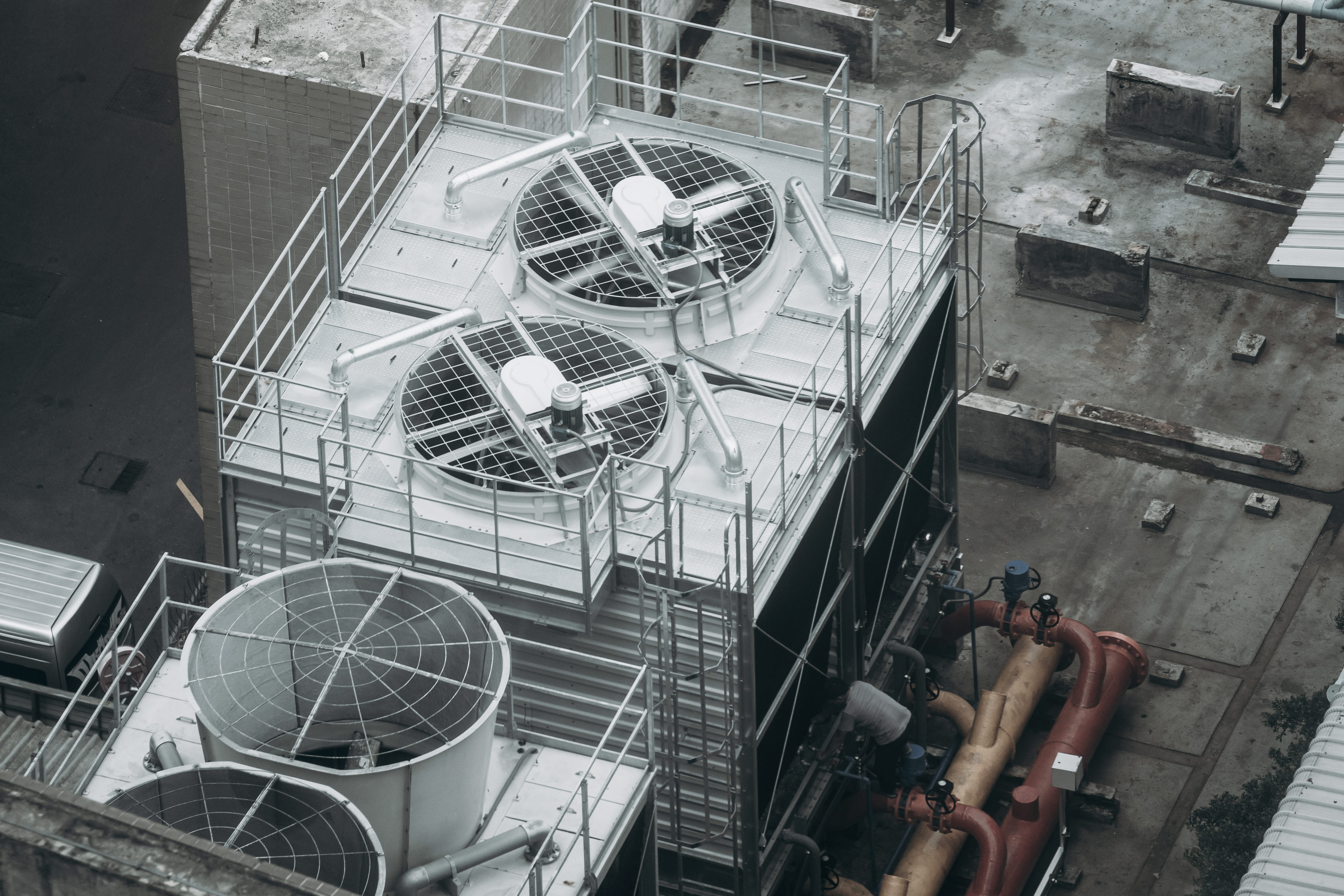 Tech Working on AC Roof Unit