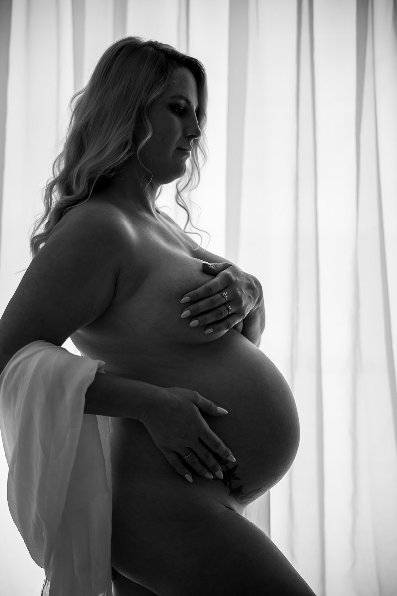 Pregnant mother photographed in natural light studio maternity session in Mackay