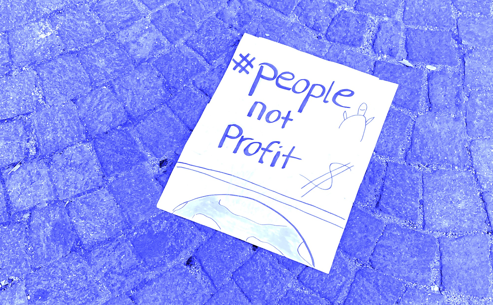 Article1 thumbnail - with a poster of 'people first, not profit'