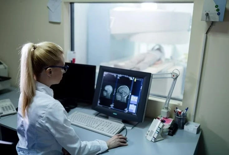 A student operating Nuclear Medicine Imaging