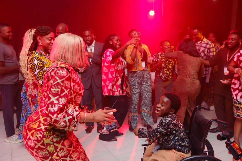 a woman holding a red flower