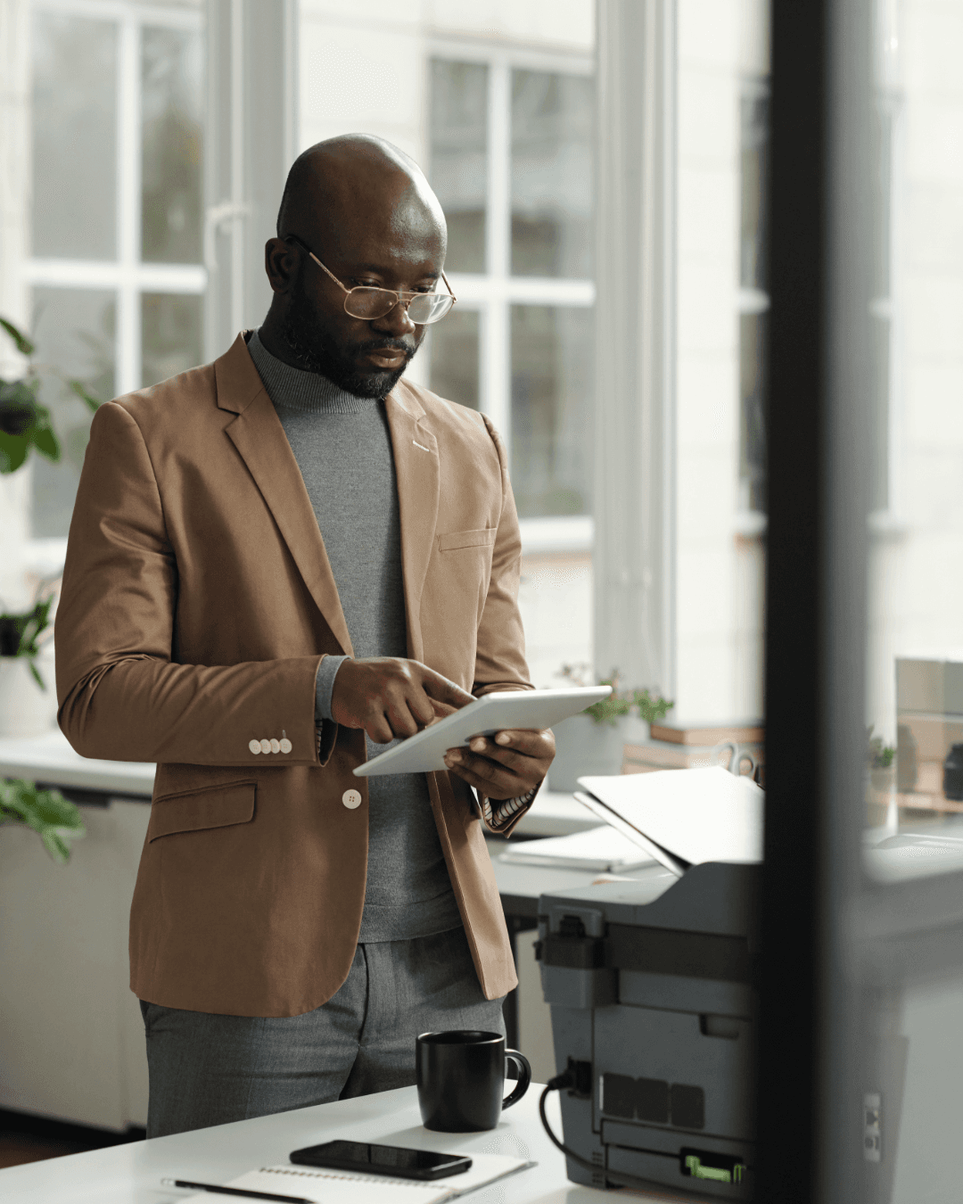 Man conducting IT Audit on a tablet