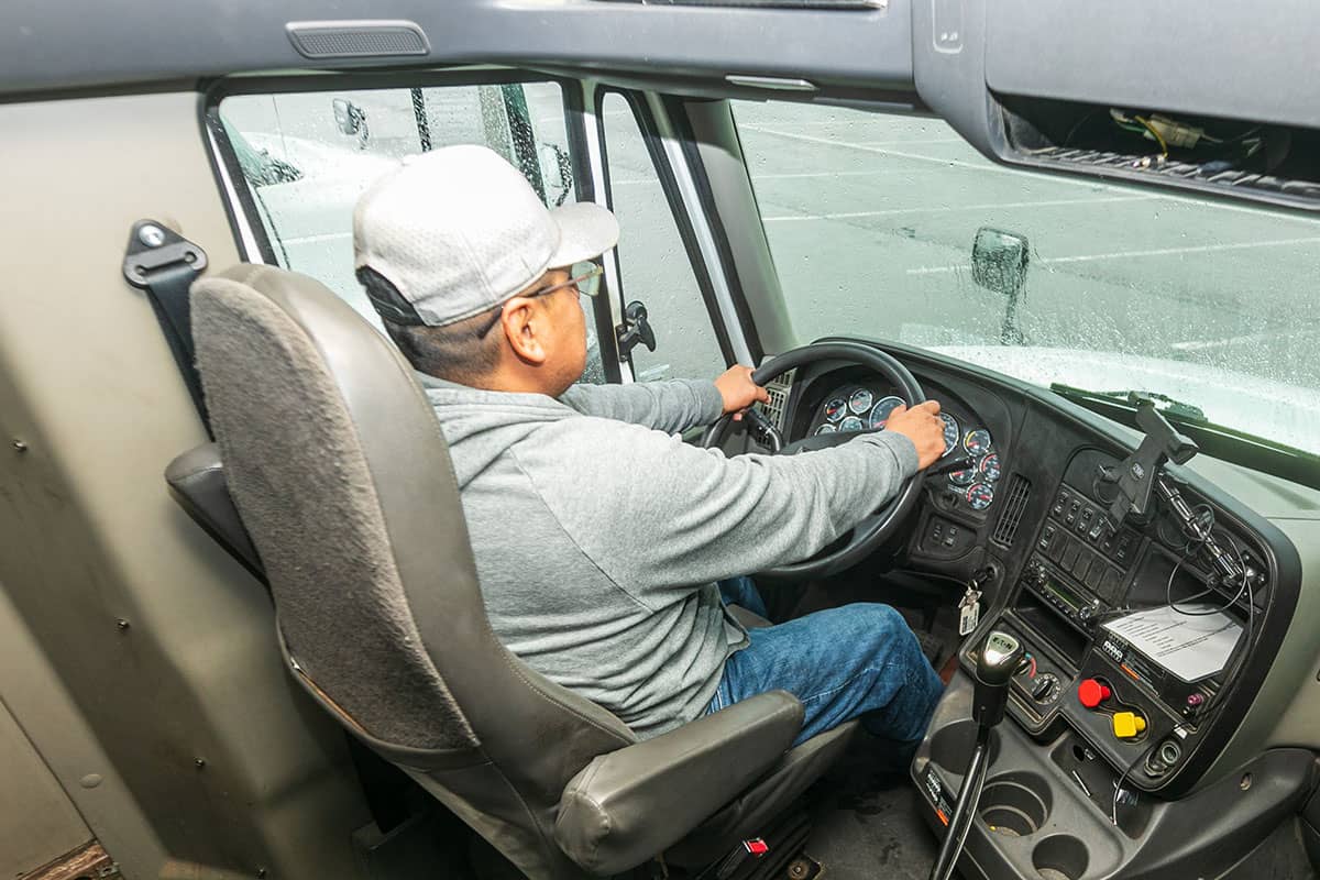 Group of aspiring truck drivers participating in a CDL training class, showcasing the effort to recruit and train new drivers