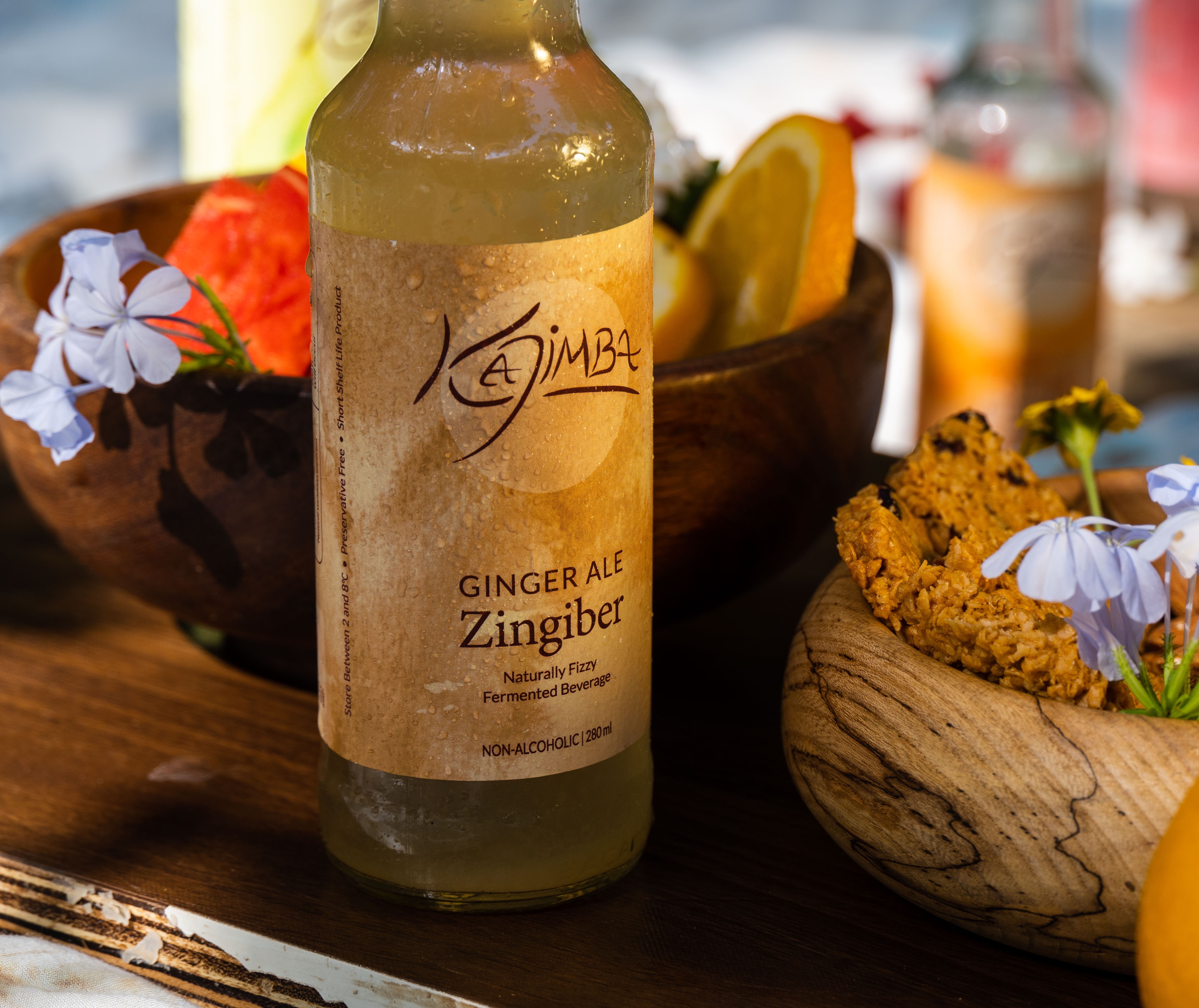 Zingiber Kajimba bottle on a picnic snack board.