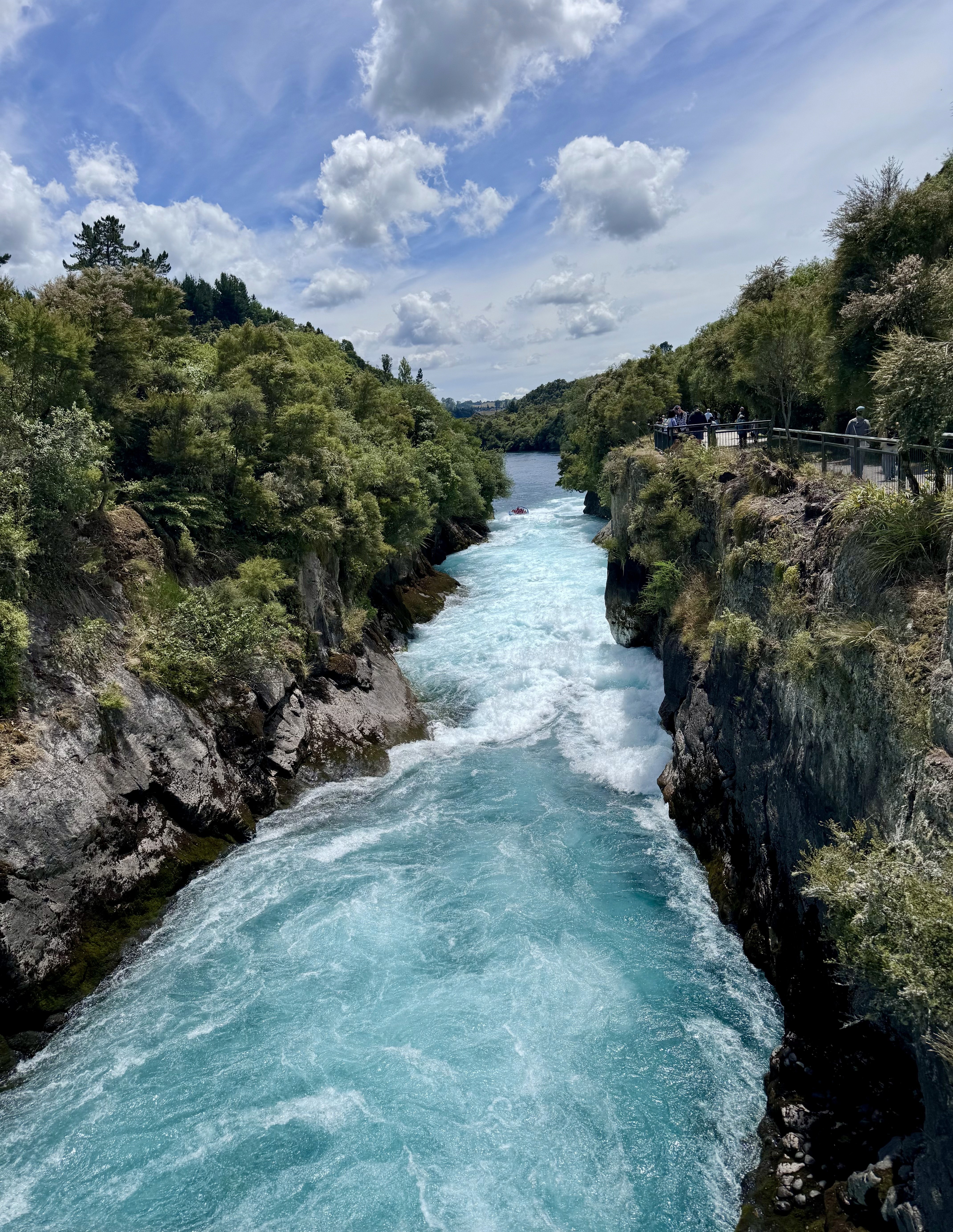 The view of Huka falls from the pedestrian bridge connecting across the river