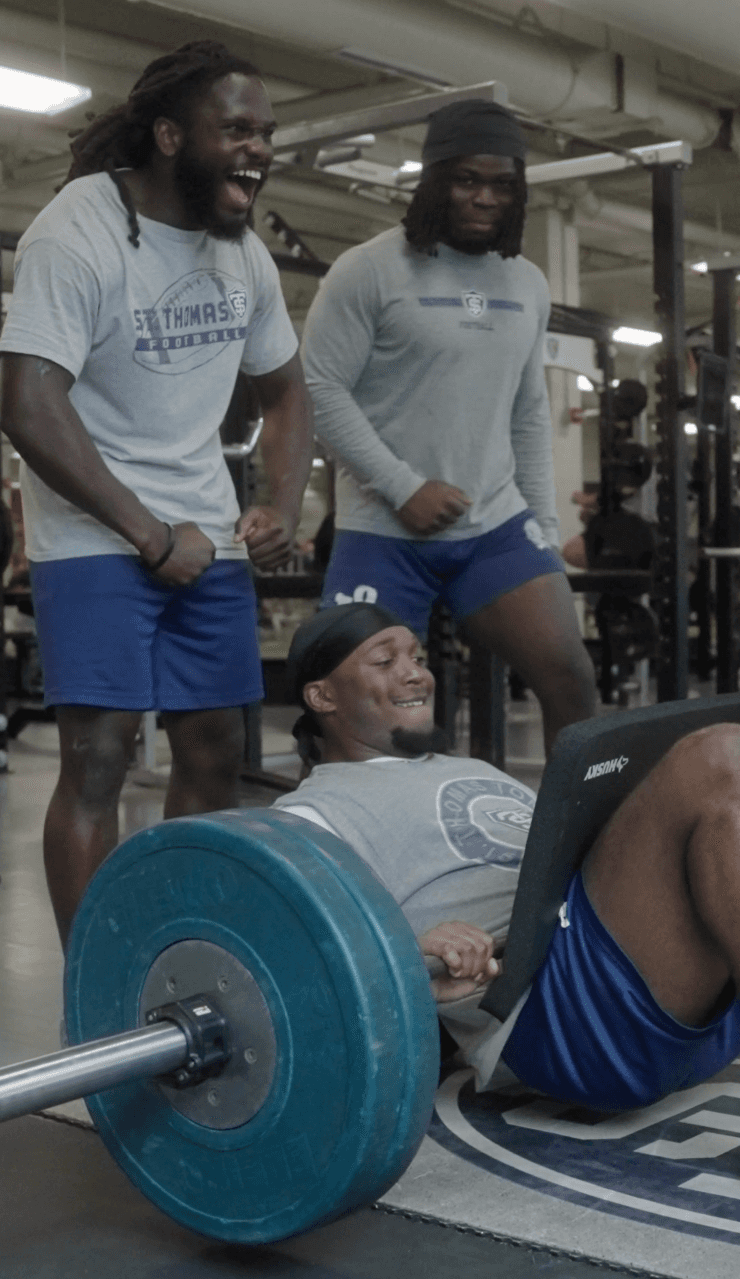 Athletes training in a gym.