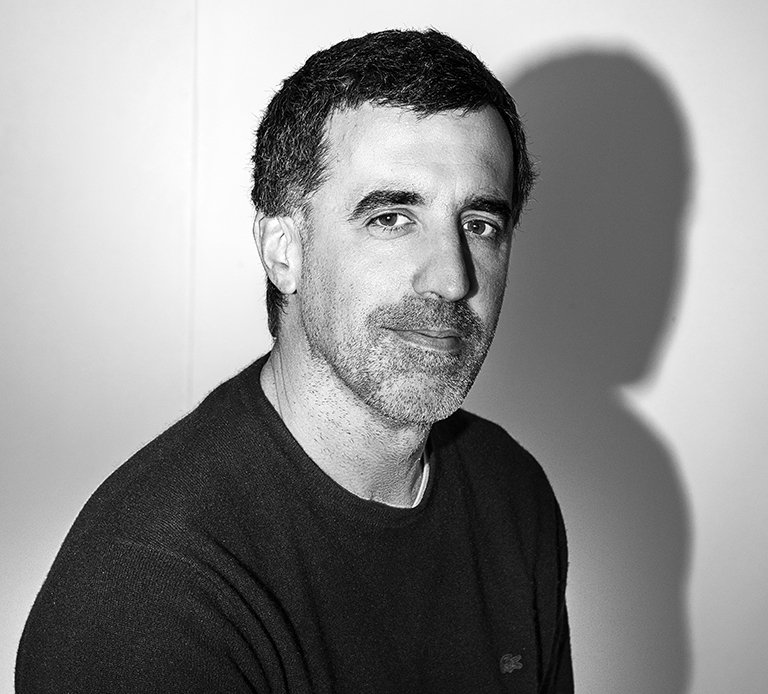 Rustic cabin in a golden field at sunset