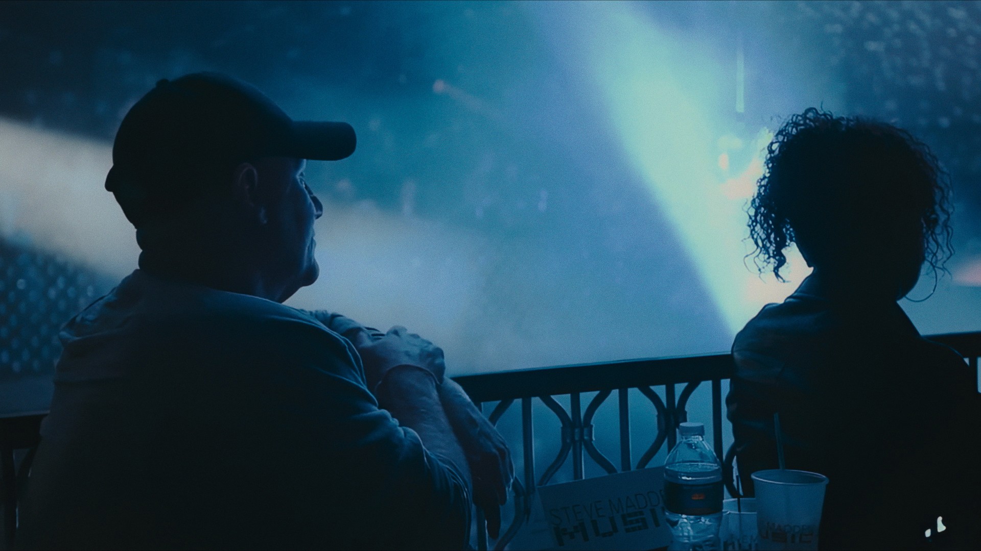 Two figures in silhouette against a blue light, from the Maddman trailer