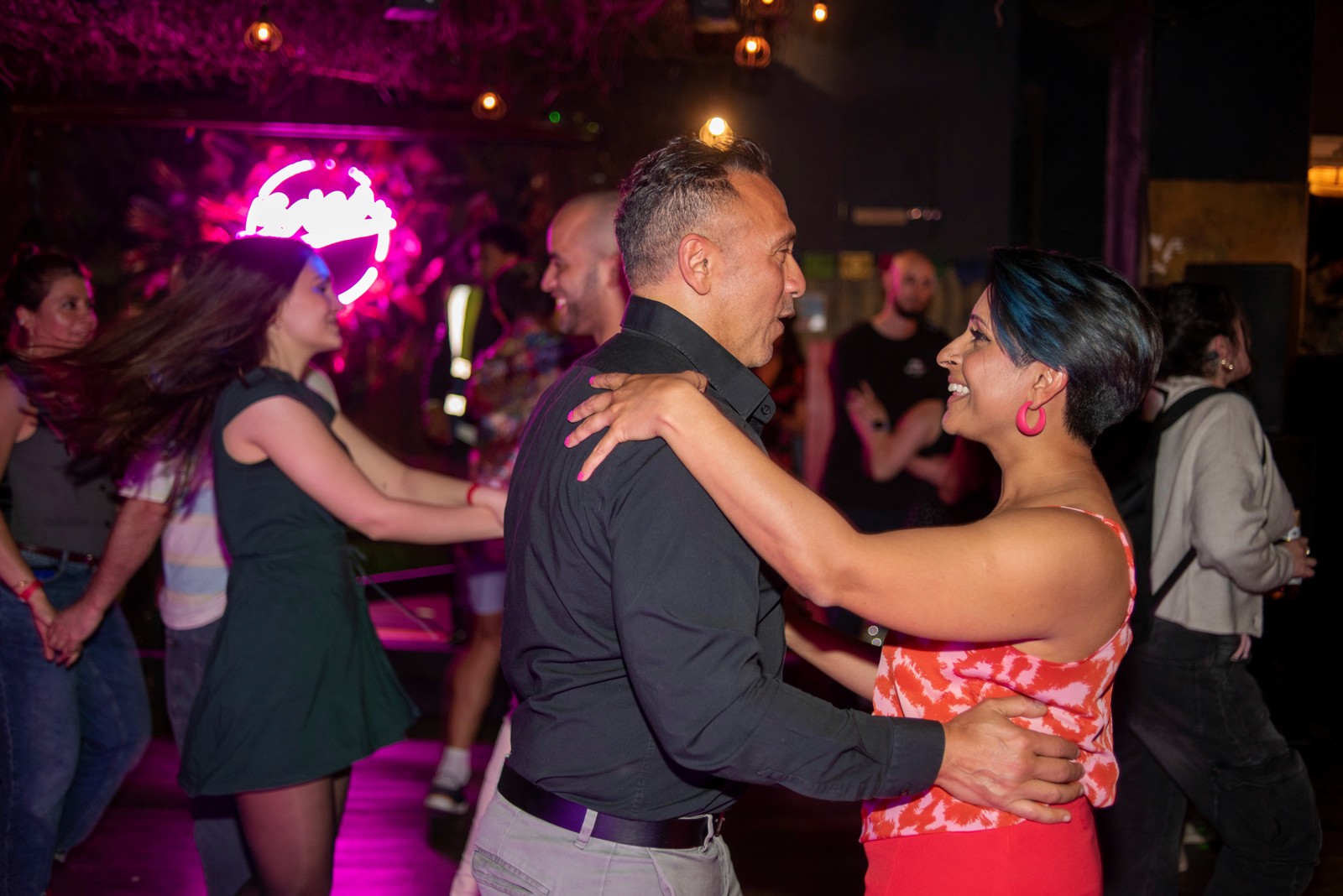 Couple enjoying a salsa evening on a Carefree break