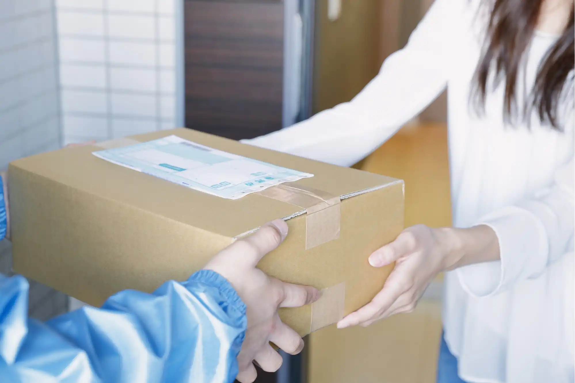 Customer receiving package delivery representing TikTok Shop's extended return window and e-commerce convenience during holidays