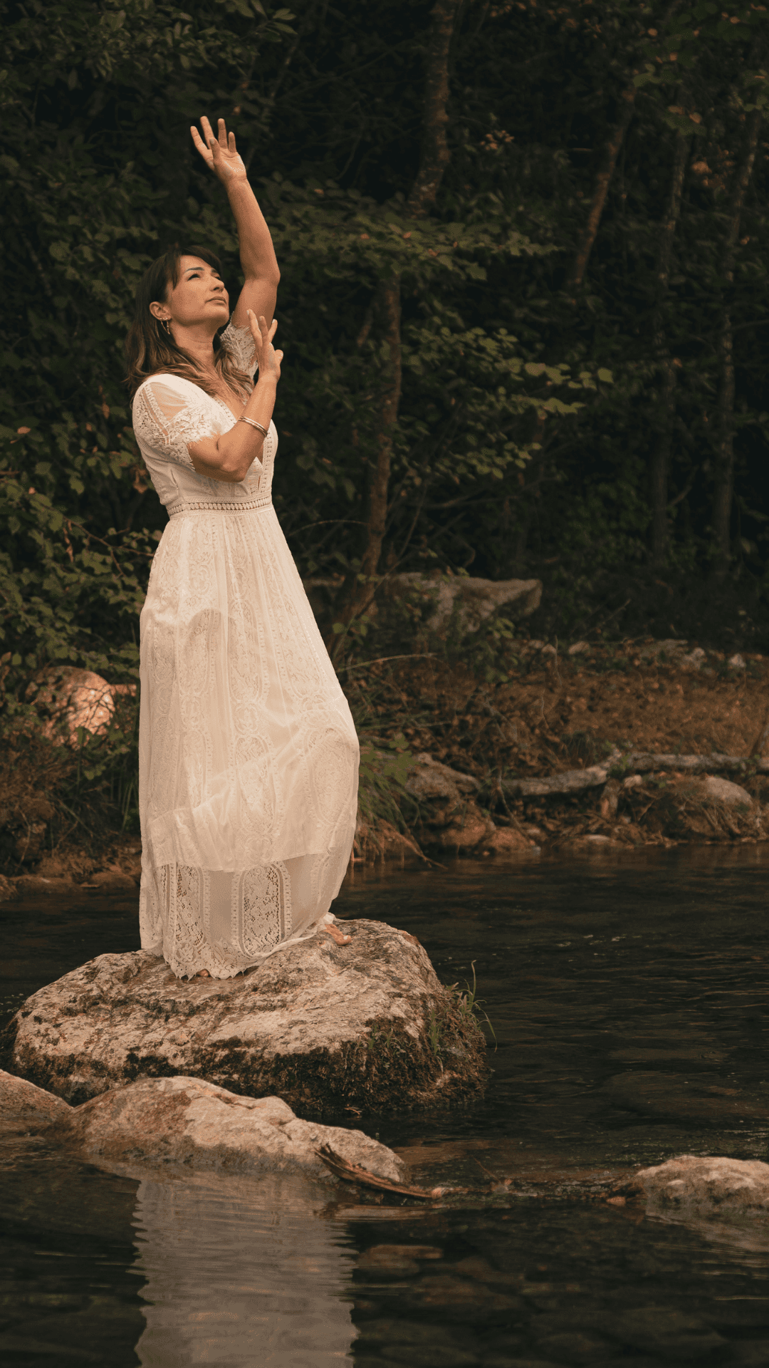 Marjorie in the middle of a river - talking to the sky