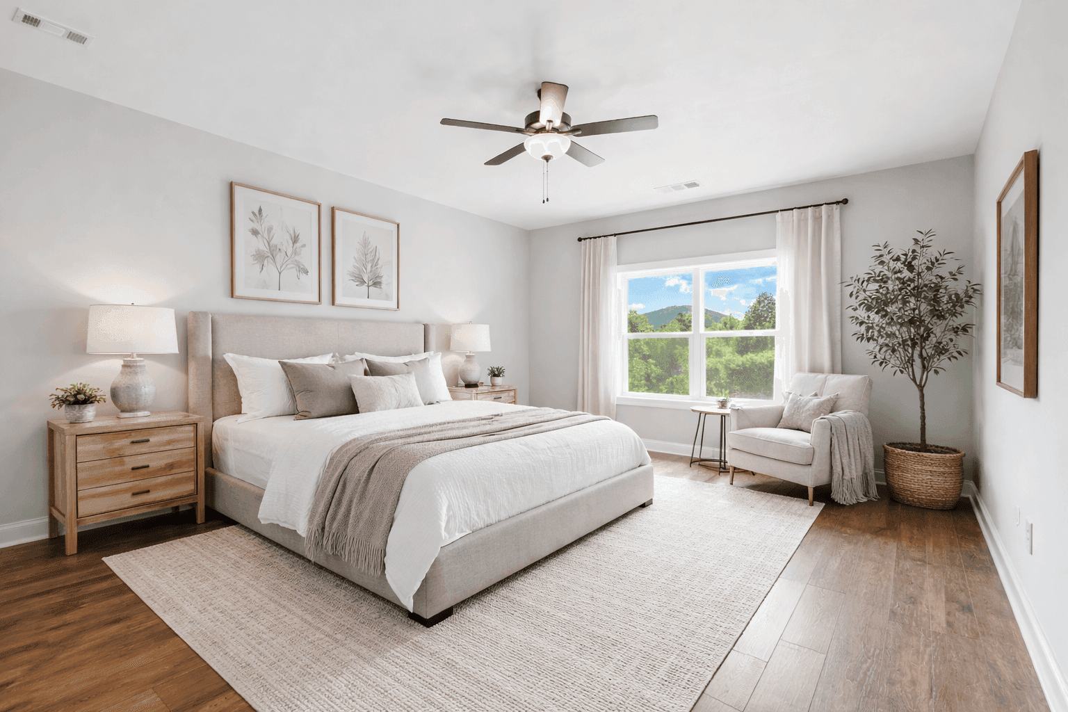 Open concept kitchen and living room with vaulted ceilings and hardwood floors