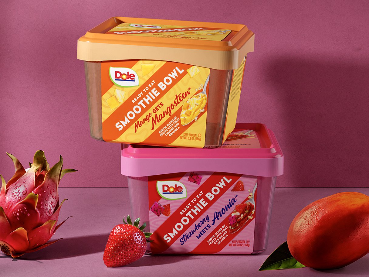 Rooftops of a coastal town with the sea in background