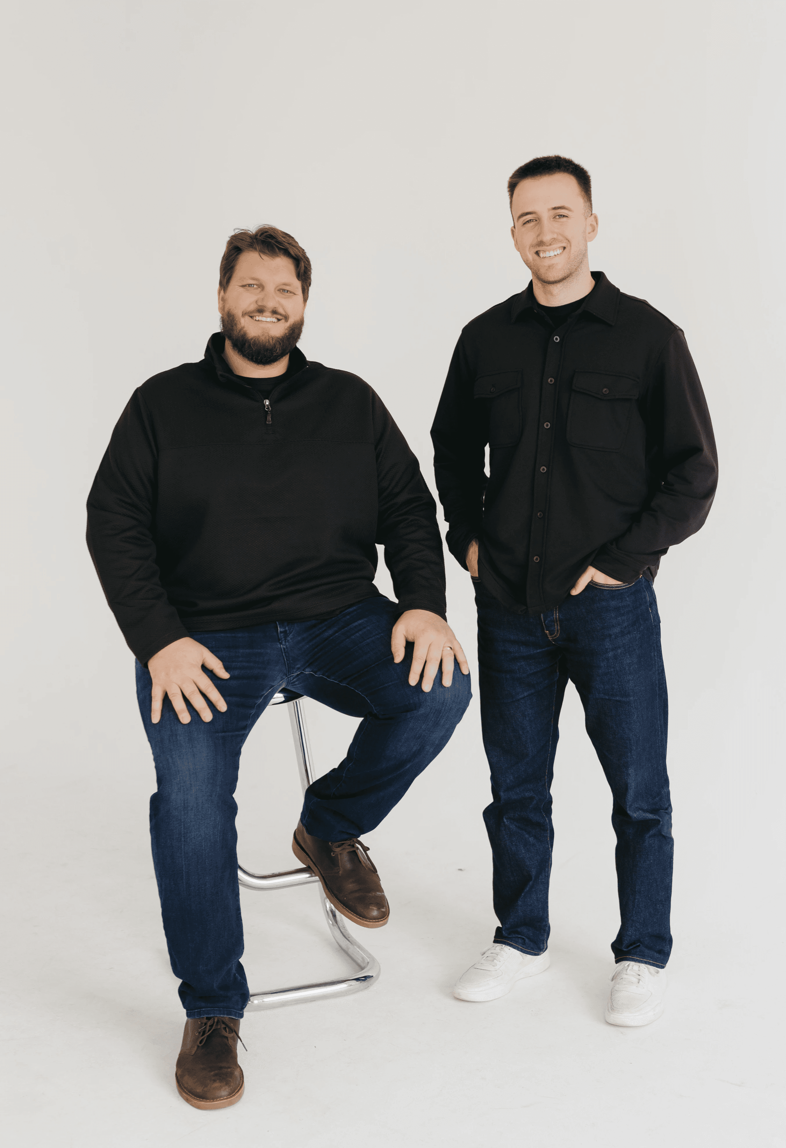 Tim Schmid and Sam Gray, Nashville property management experts and founders of Cardinal Property Management, standing together in Nashville, TN
