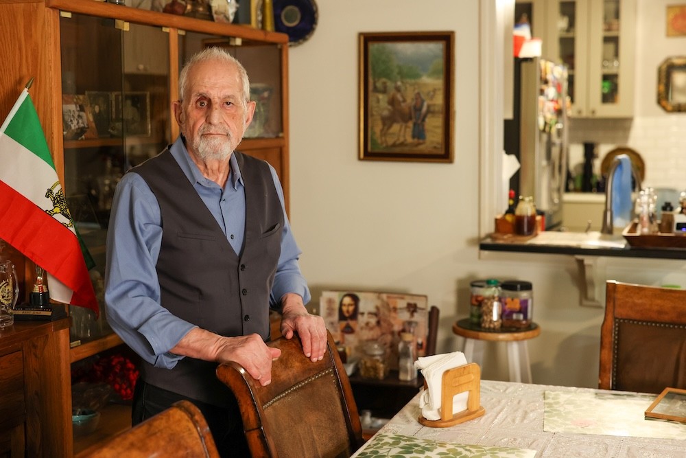 Bubjan with book and speaking to camera
