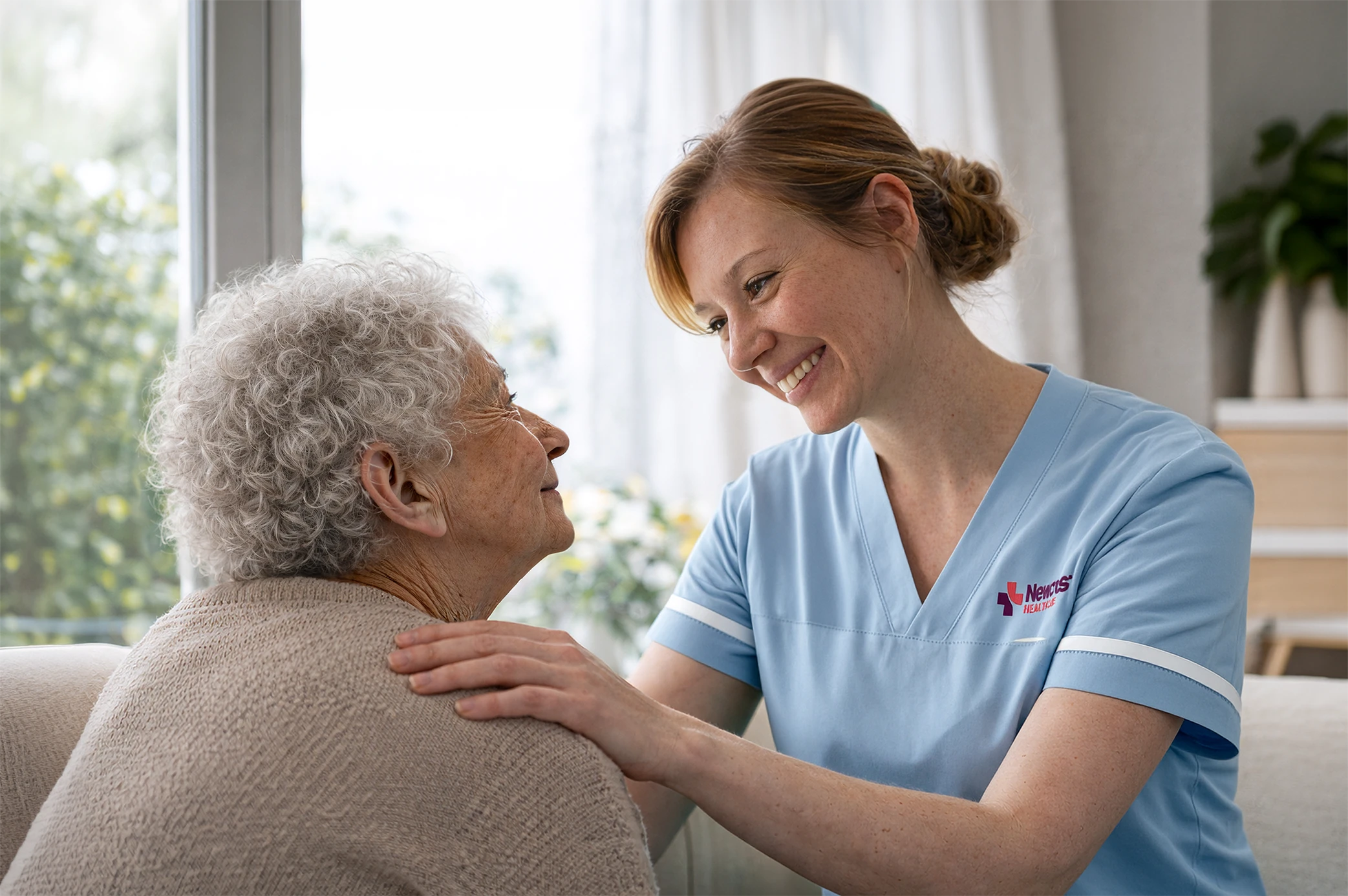 Newcross healthcare worker working with an elderly woman in a care setting