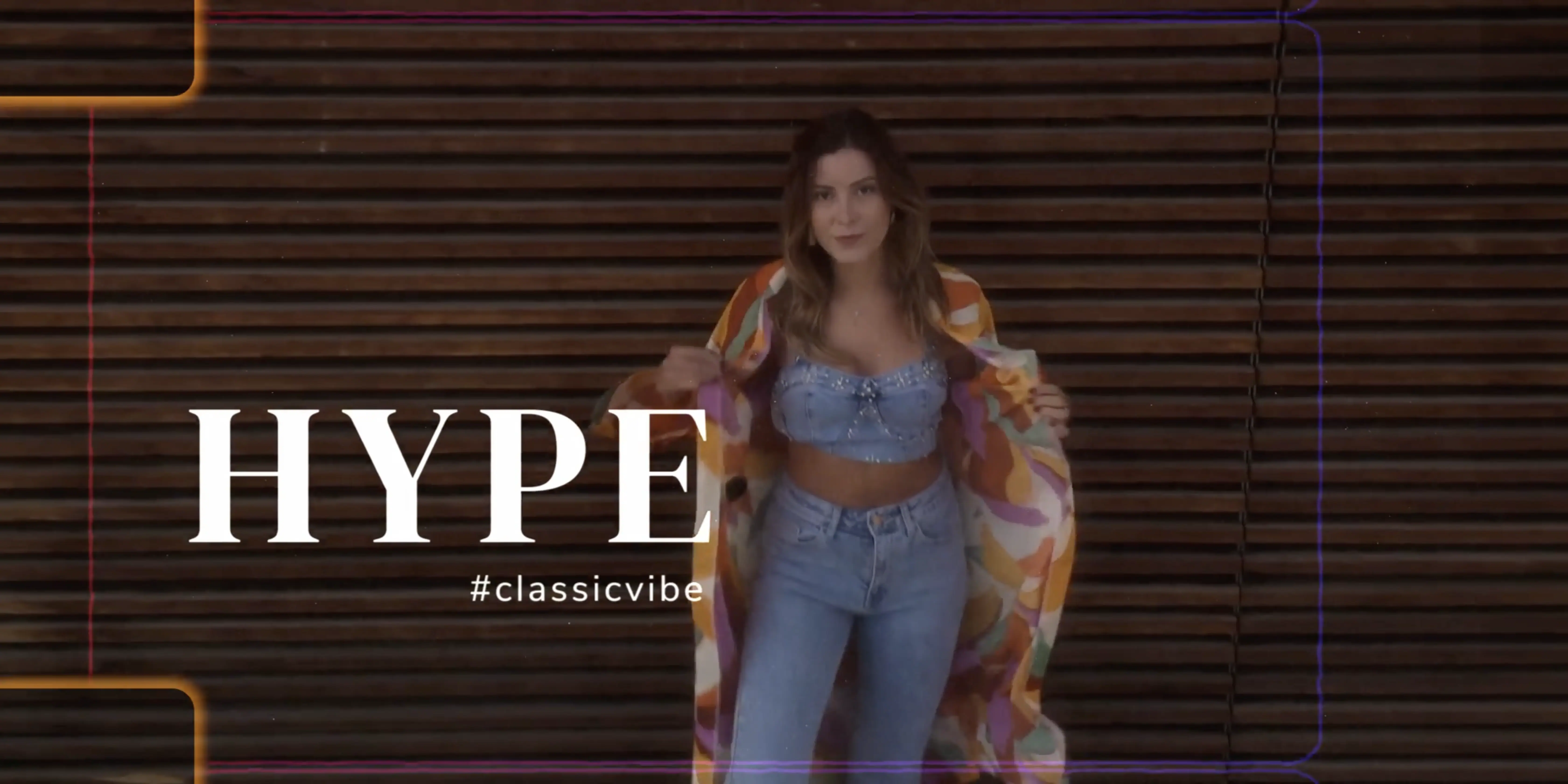 A person wearing a stylish outfit with a patterned coat and denim pants poses confidently in front of a wooden slat background, featuring the word "HYPE" and the hashtag "#classicvibe" in bold text.