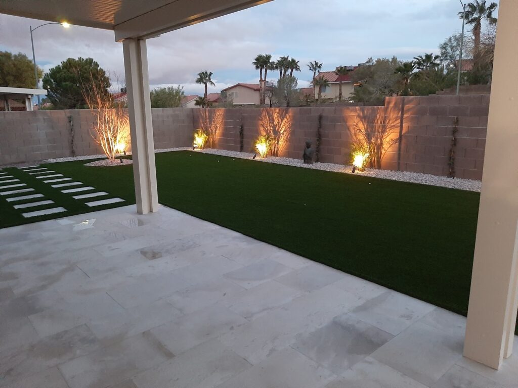 FreshStart Landscaping Vegas backyard with artificial turf and patio area outdoor living space