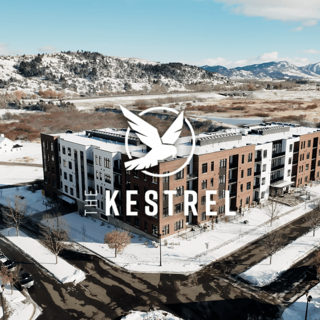 Aerial view of The Kestrel Apartments in Bozeman, Montana surrounded by mountain scenery