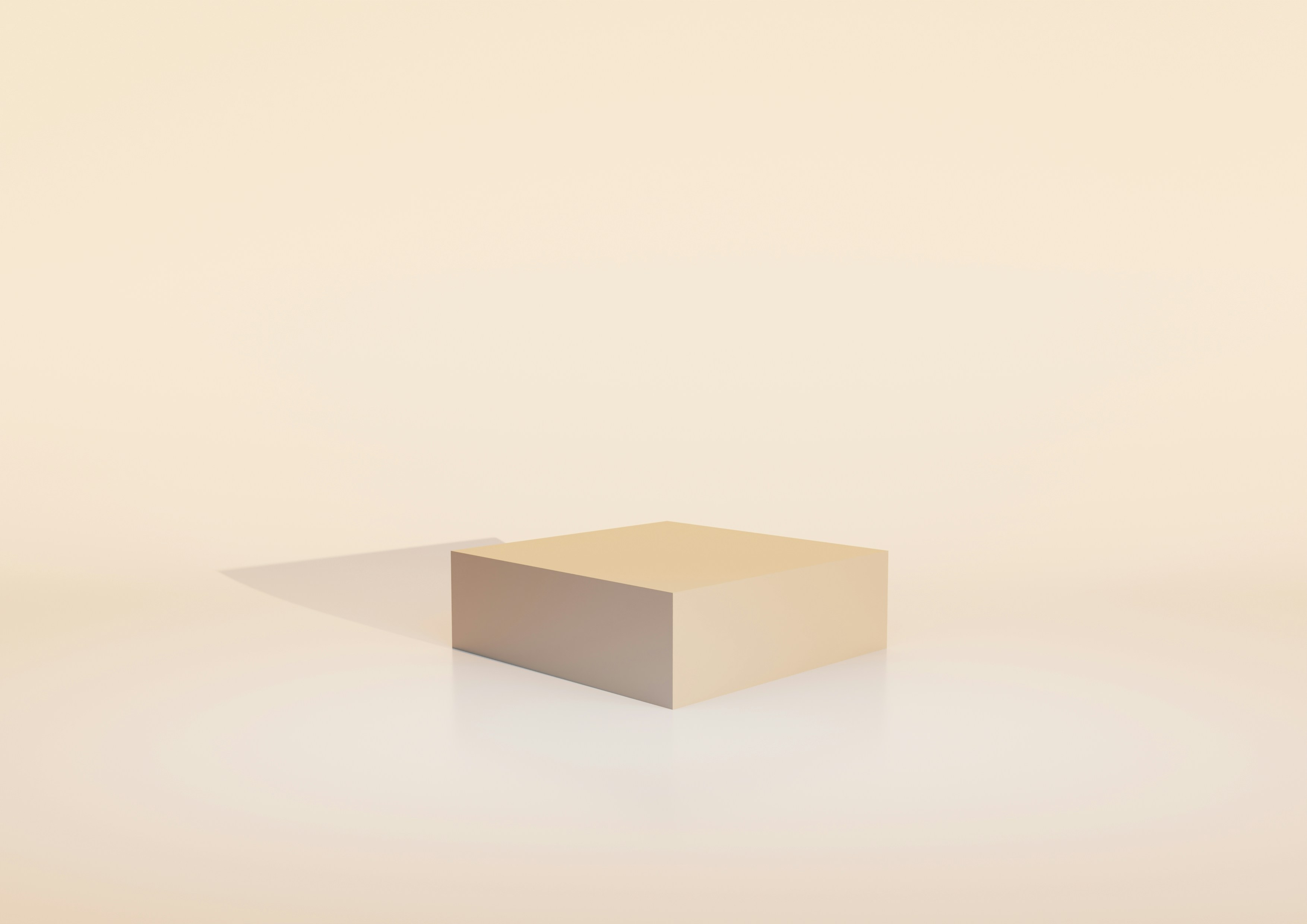 A light brown cube on a reflective surface.