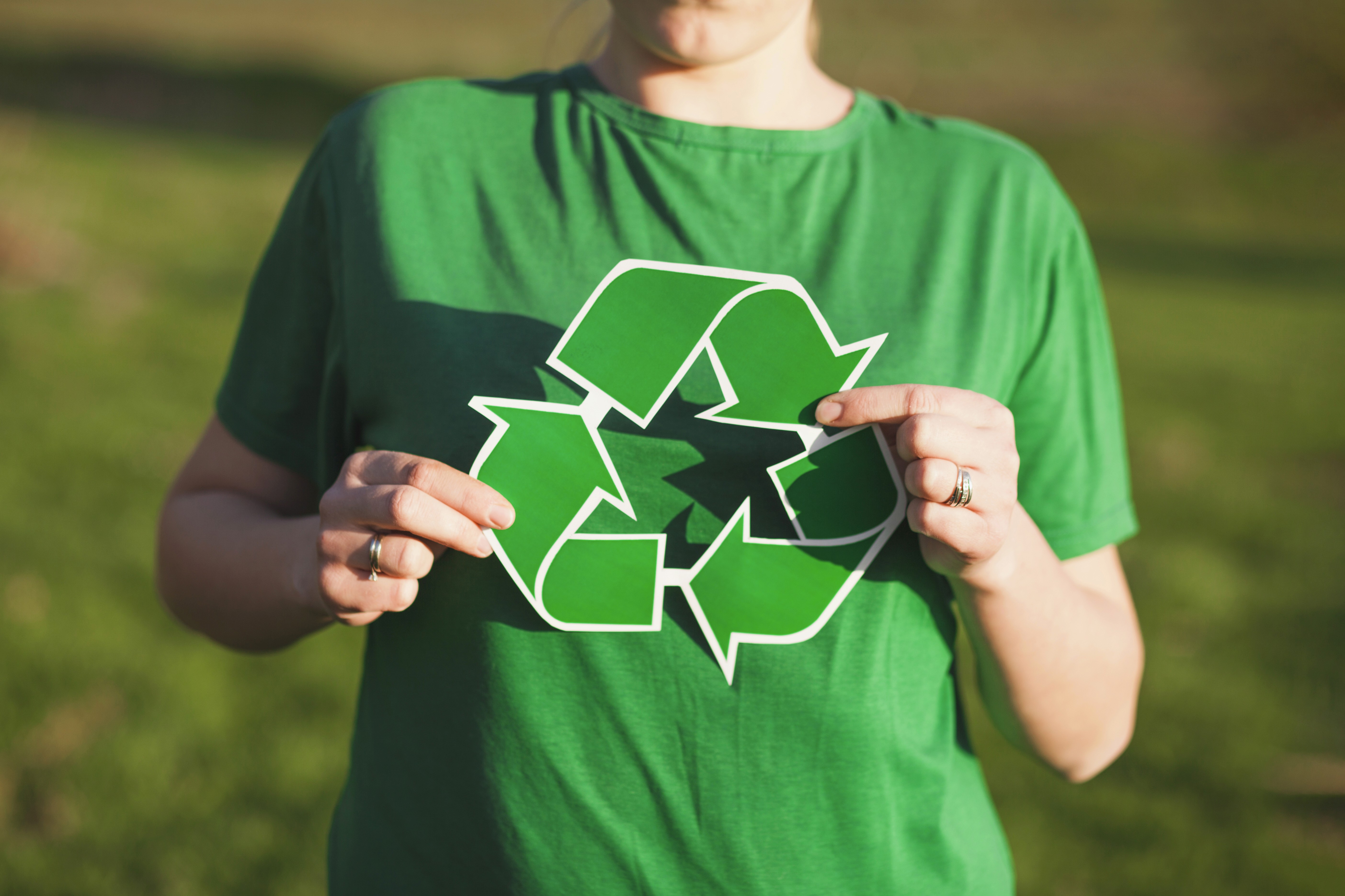 Blurred figures of people walking in a busy station.
