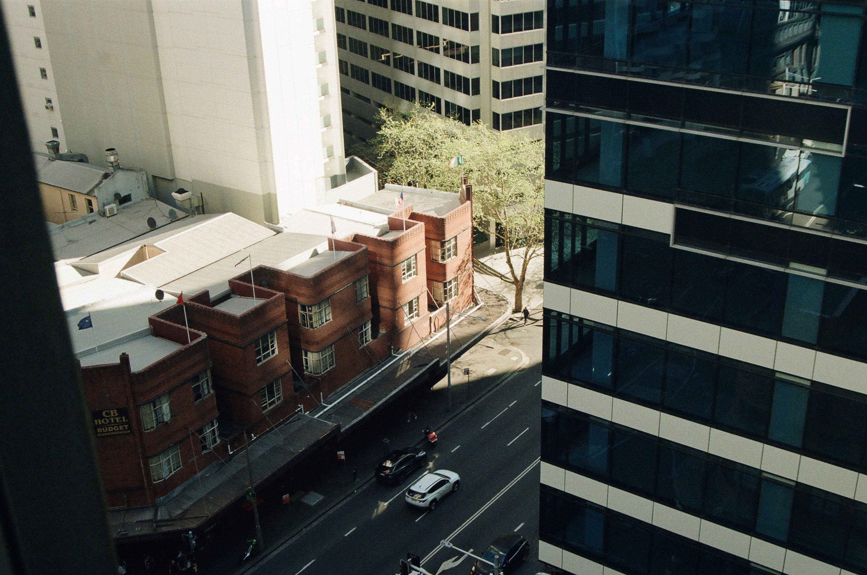 Urban buildings and a busy street below.