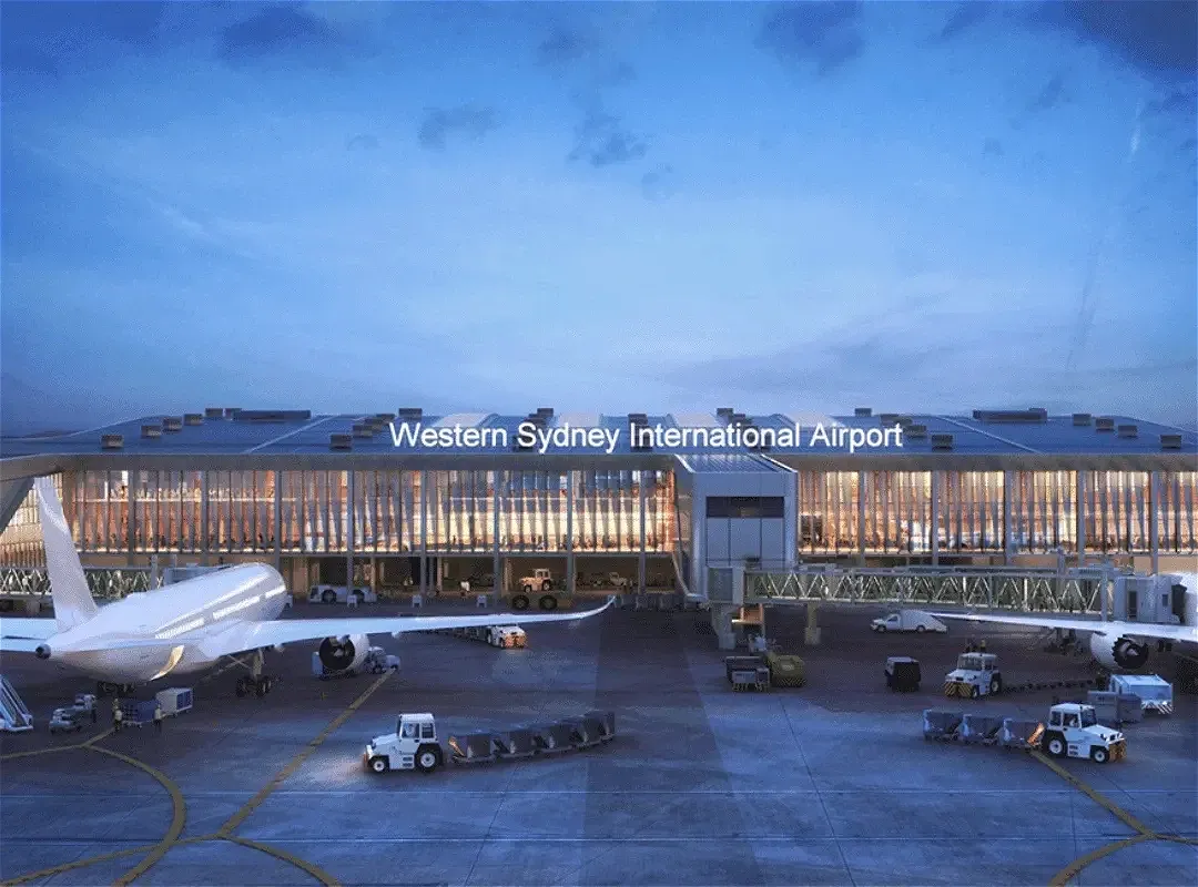 Western Sydney International Airport terminal with planes and vehicles
