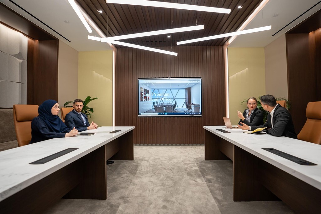 Minimalist Abu Dhabi meeting rooms with built-in AV systems, ideal for business landmarks.