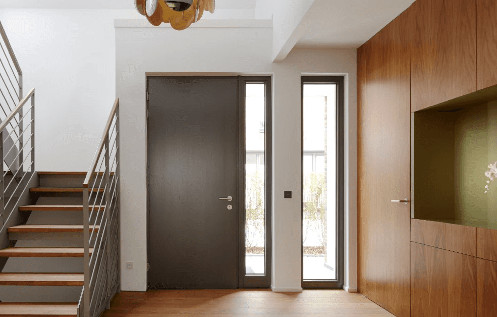 husband and wife working happily on a laptop