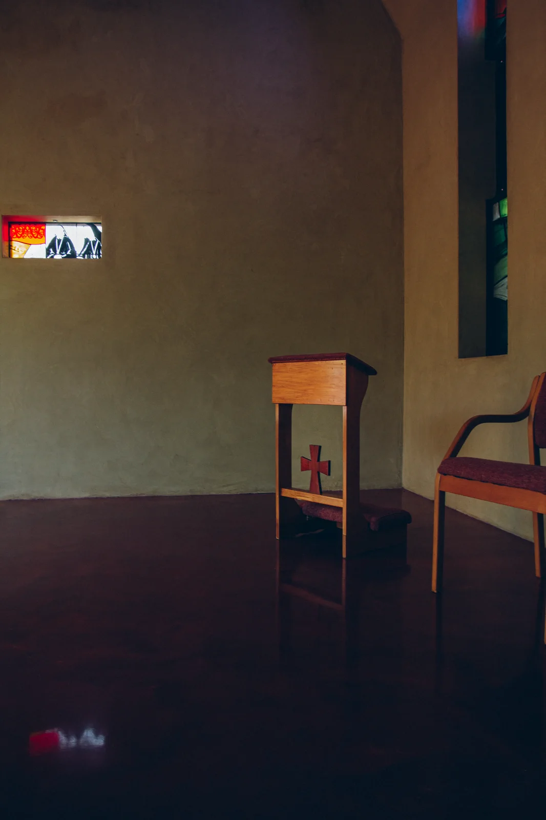 Chapel interior with chair and stained glass