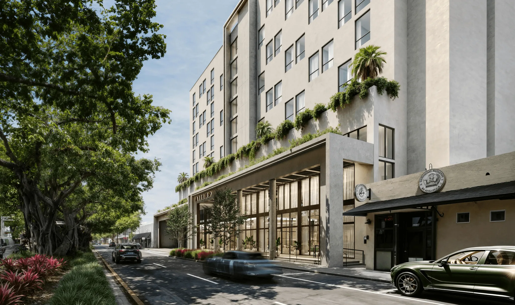 Hotel at street corner with entrance and surrounding urban landscape.