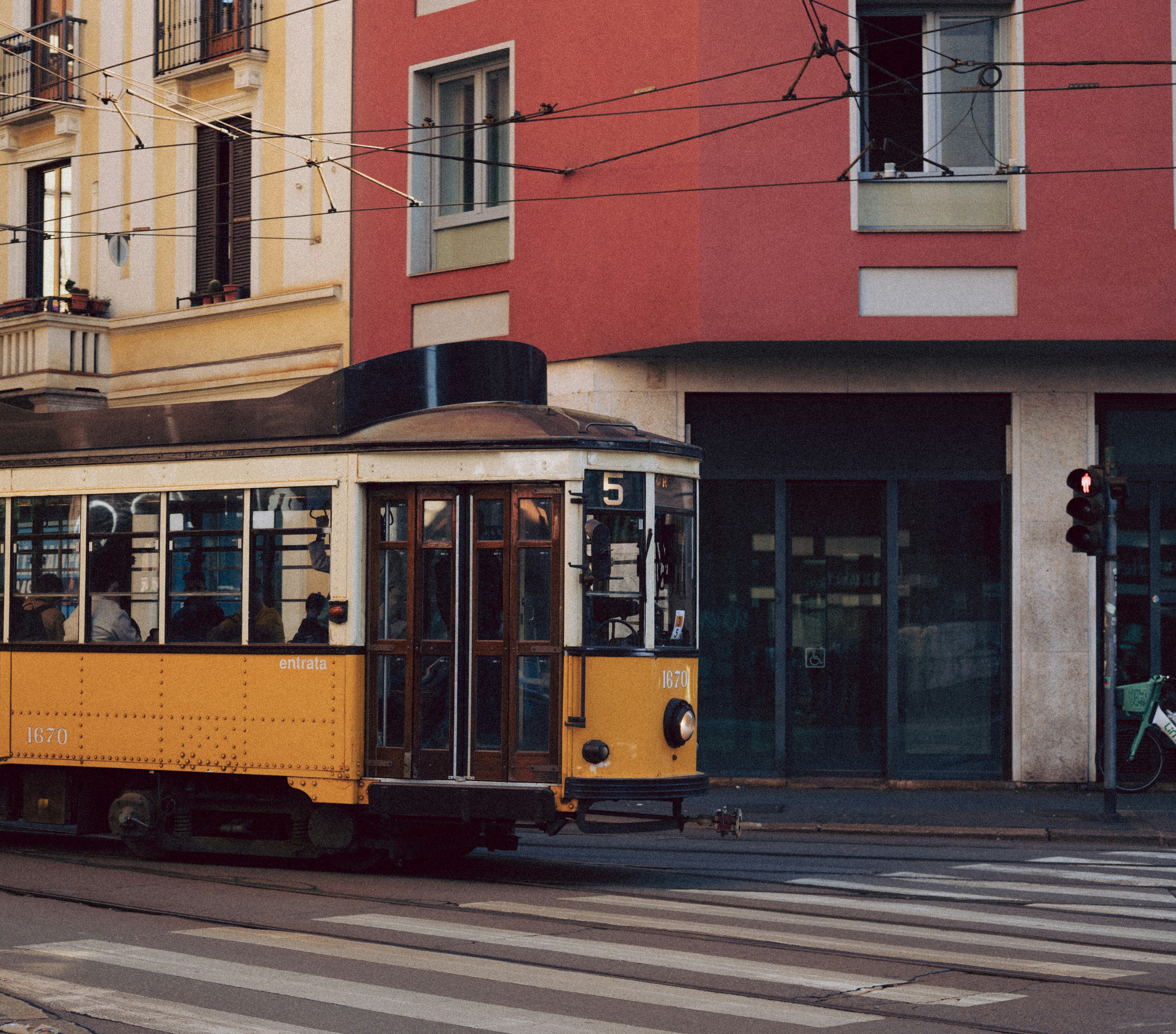 Yellow tram on a city street