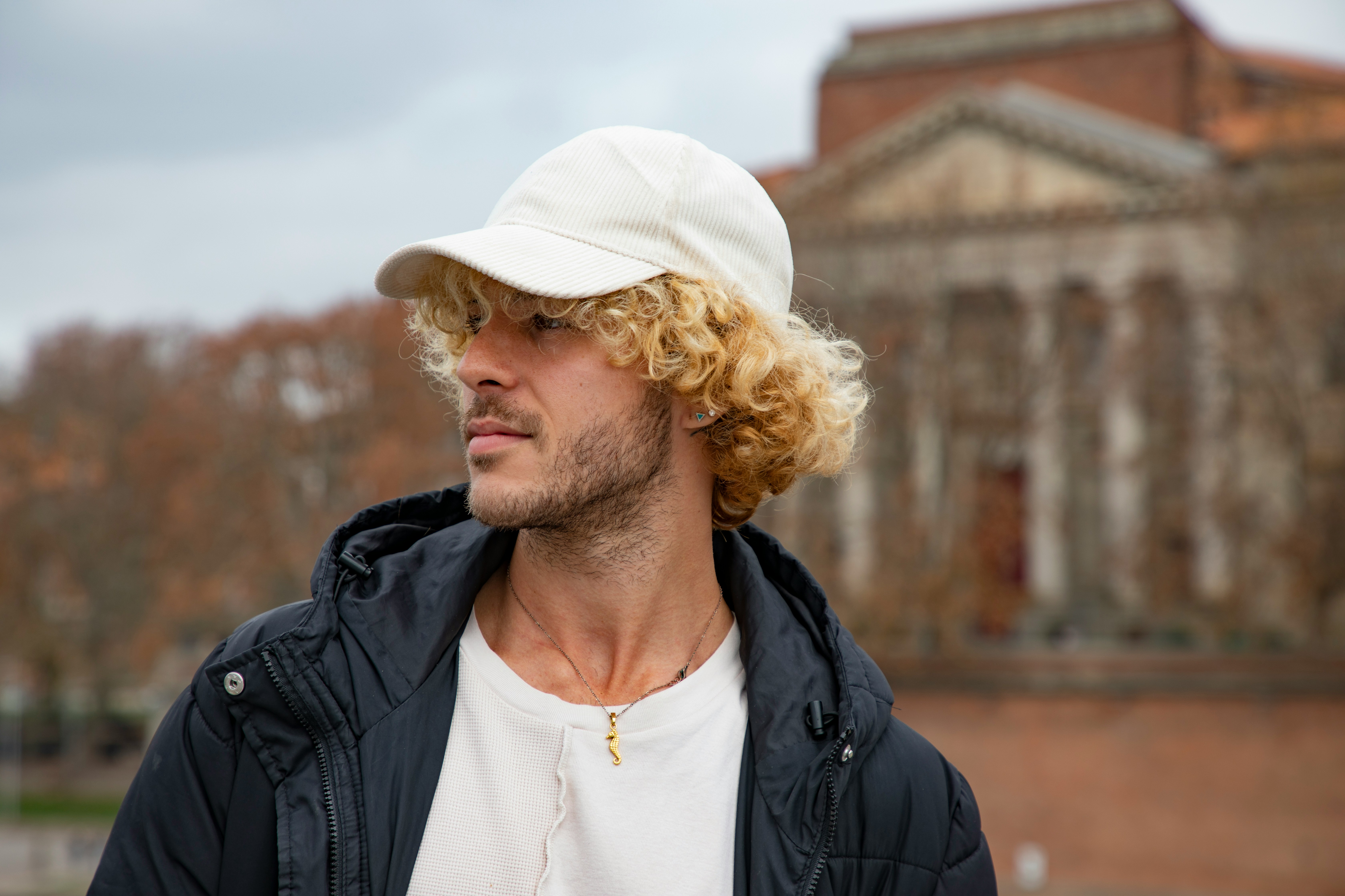 man with cap and Short Curly Hair Men